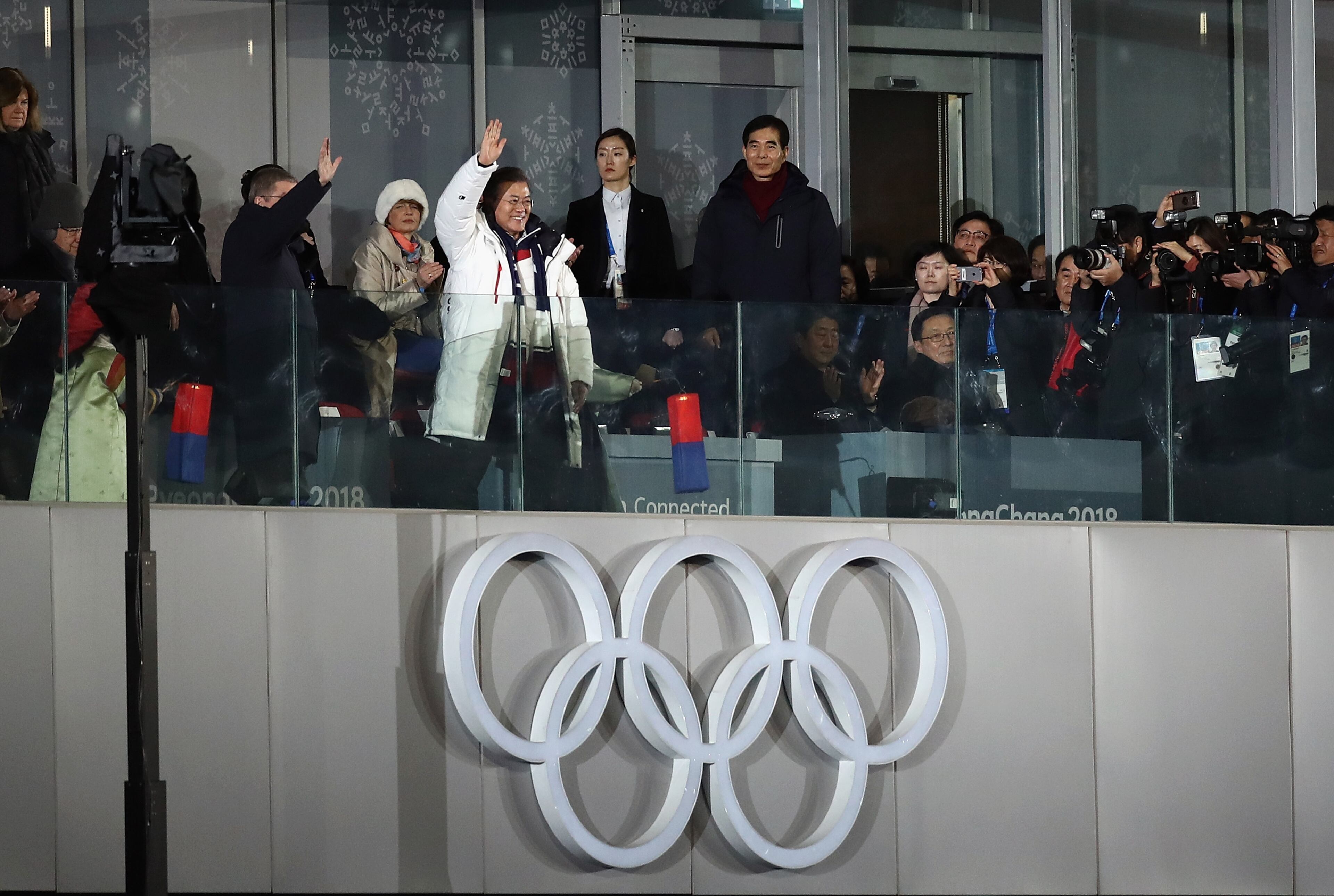 PYEONGCHANG-GUN, SOUTH KOREA - FEBRUARY 09: President Moon Jai-in of South Korea and IOC President Thomas Bach wave during the Opening Ceremony of the PyeongChang 2018 Winter Olympic Games at PyeongChang Olympic Stadium on February 9, 2018 in Pyeongchang-gun, South Korea. (Photo by Ronald Martinez/Getty Images)
