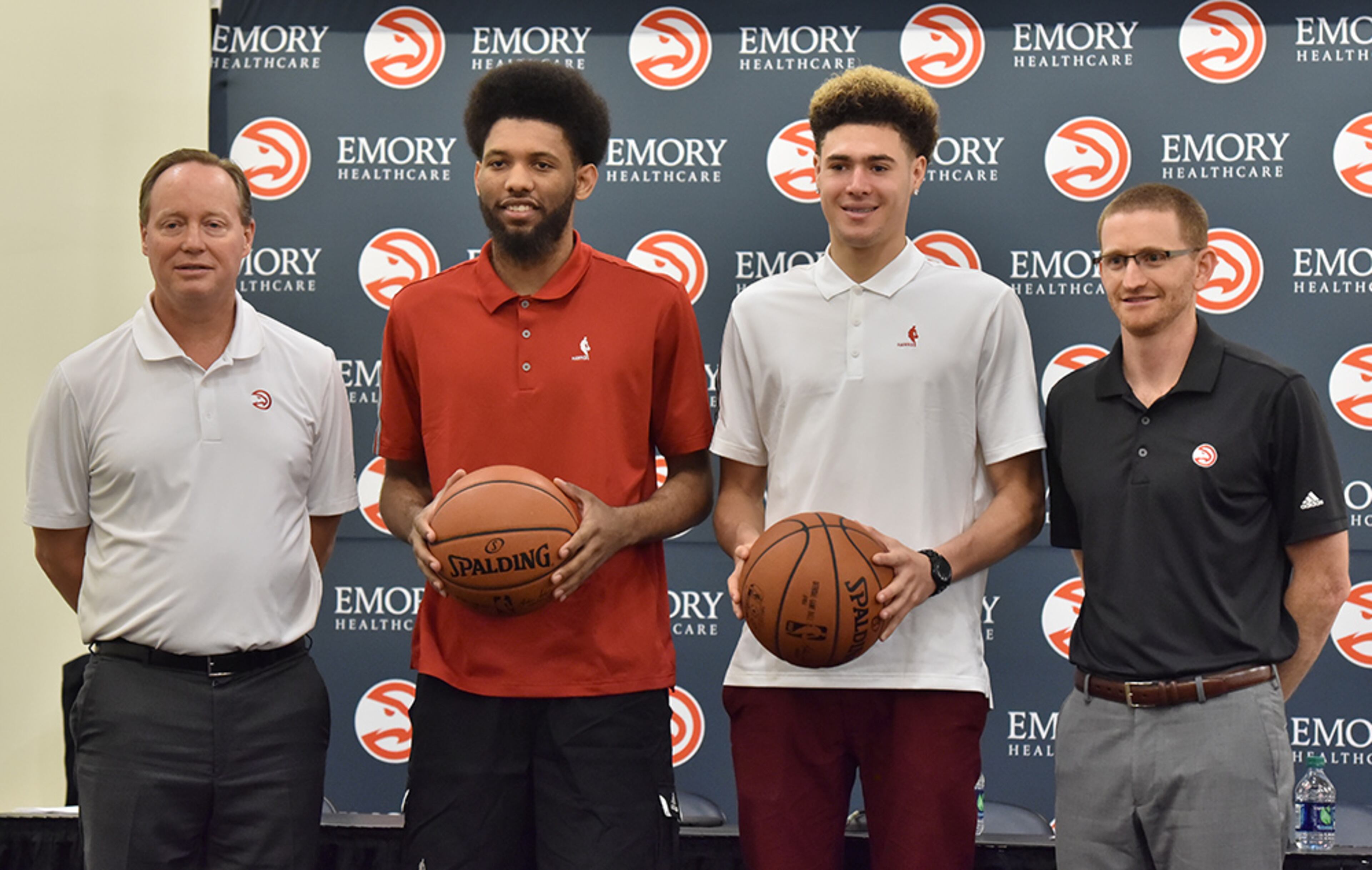 DeAndre' Bembry (center left) and Isaia Cordinier (center right) pose with head coach Mike Budenholzer (left) and assistant general manager Wes Wilcox during a press conference Tuesday, June 28, 2016. Atlanta already has 10 players under contract for next season, not counting Bembry.