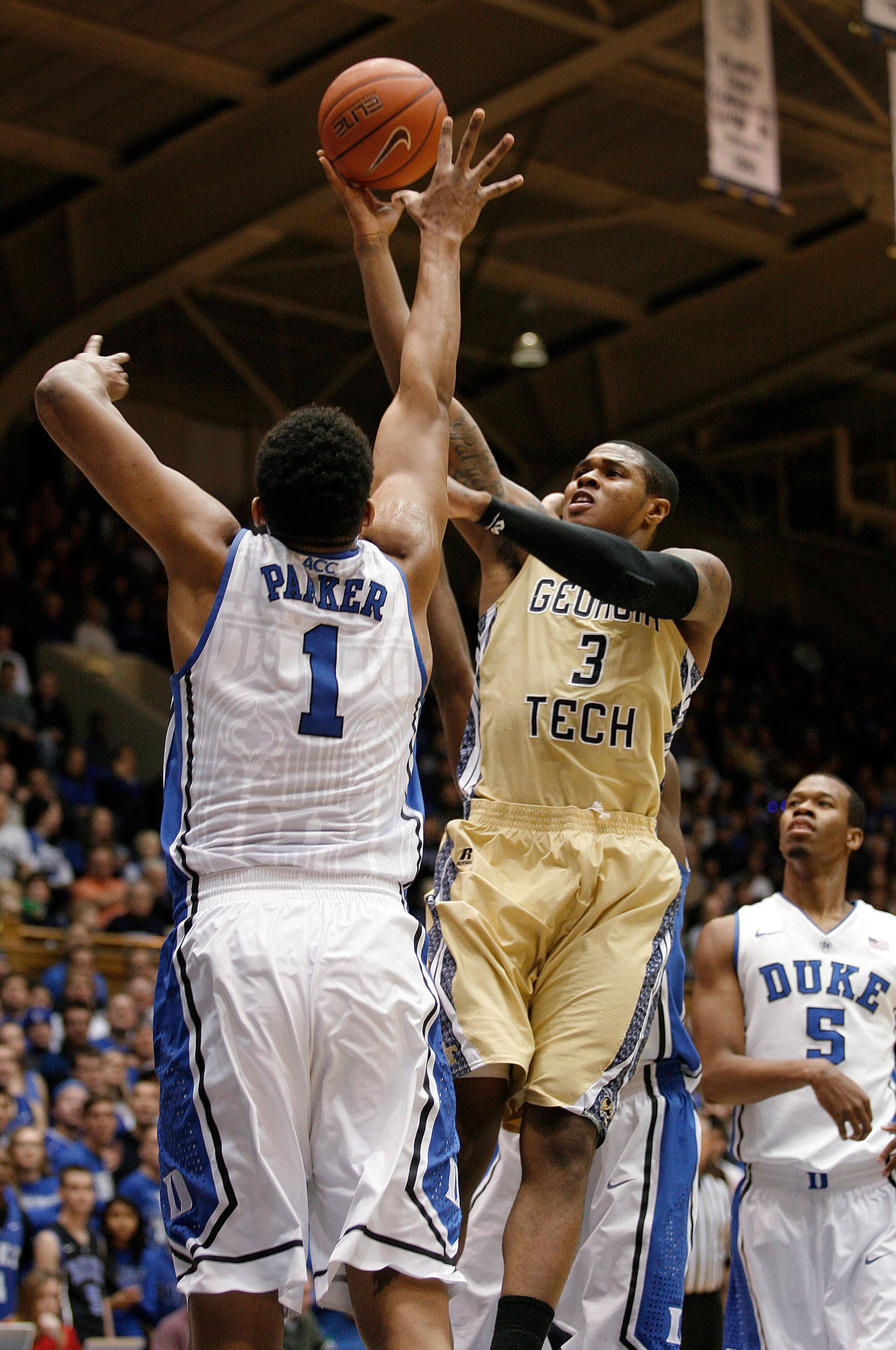Georgia Tech Yellow Jackets guard/forward Marcus Georges-Hunt (3) shoots over Duke Blue Devils forward Jabari Parker (1) at Cameron Indoor Stadium.
