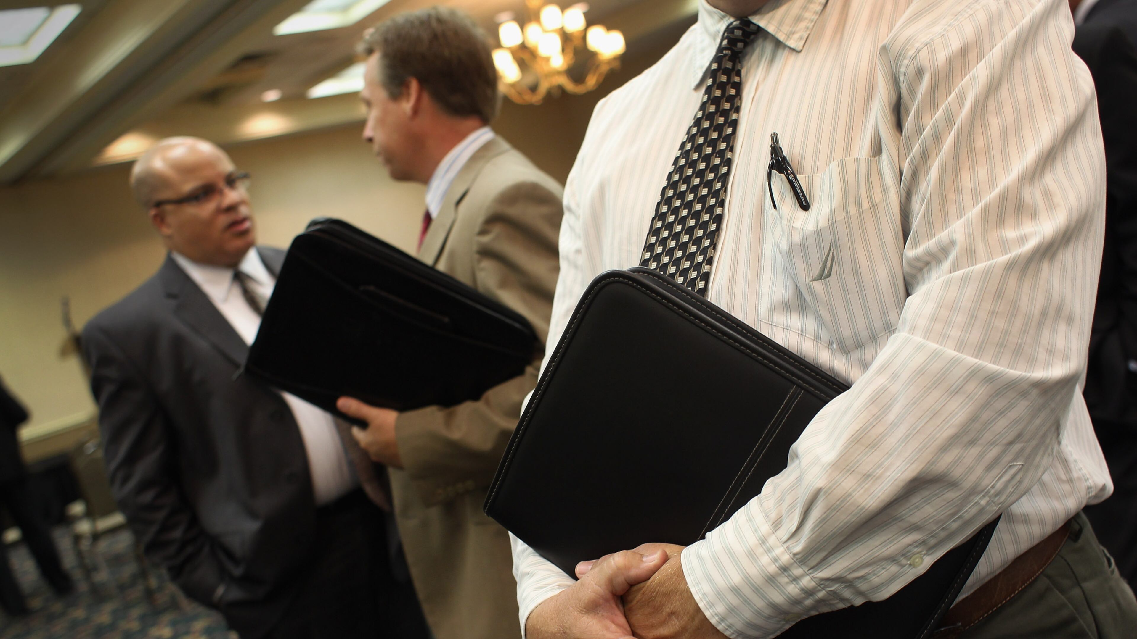 WESTMINSTER, CO - JULY 20: Coloradans wait to meet potential employers at a sales and management career fair on July 20, 2011 in Westminster, Colorado. The job fair, organized by United Career Fairs, featured a dozen potential employers looking to hire sales representatives and managers. (Photo by John Moore/Getty Images)