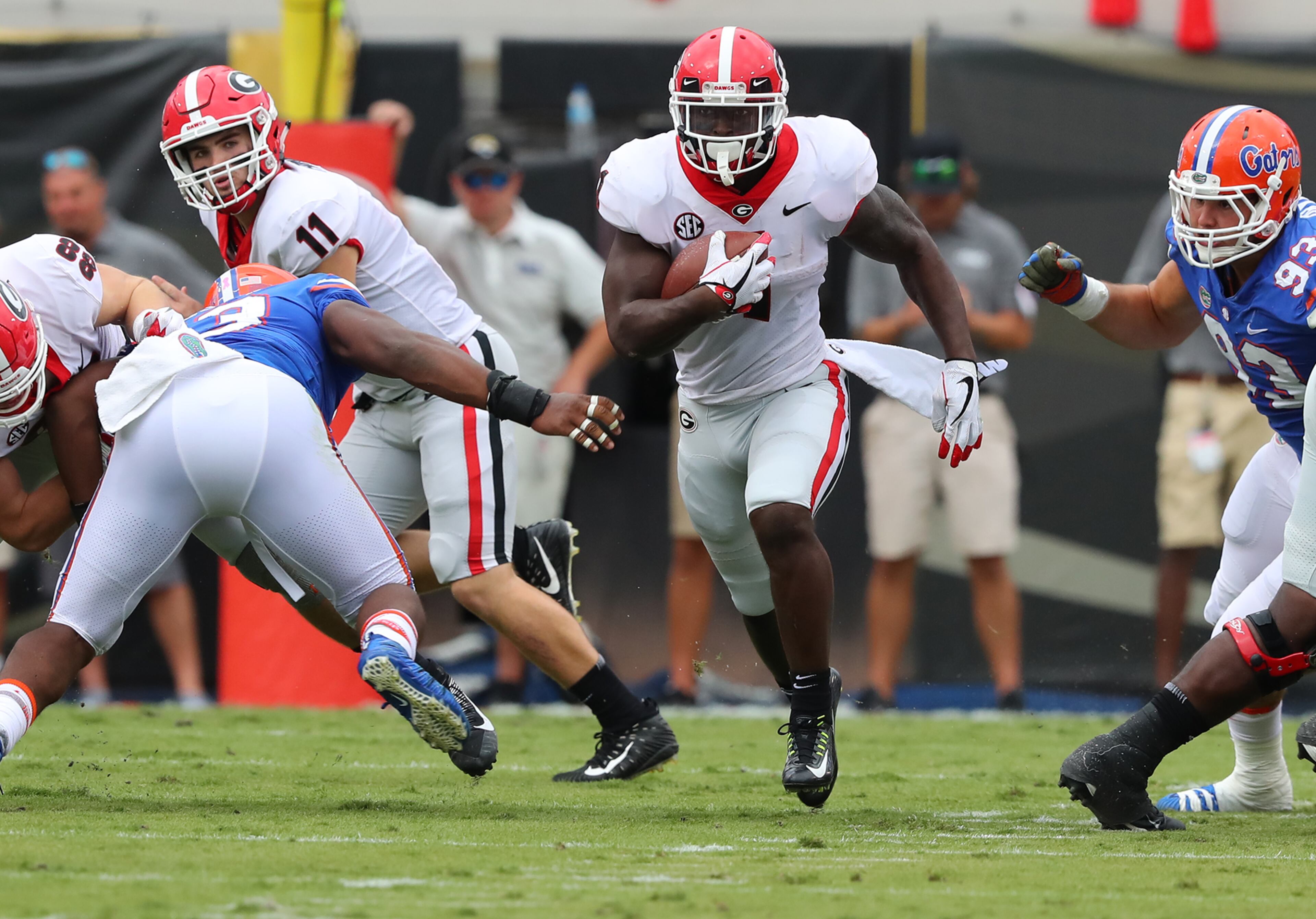 October 28, 2017 Jacksonville: Georgia tailback Sony Michel breaks away from Florida defenders for a long touchdown run to take a 21-0 lead during the first quarter in the Georgia-Florida NCAA college football game on Friday, October 27, 2017, in Jacksonville. Curtis Compton/ccompton@ajc.com