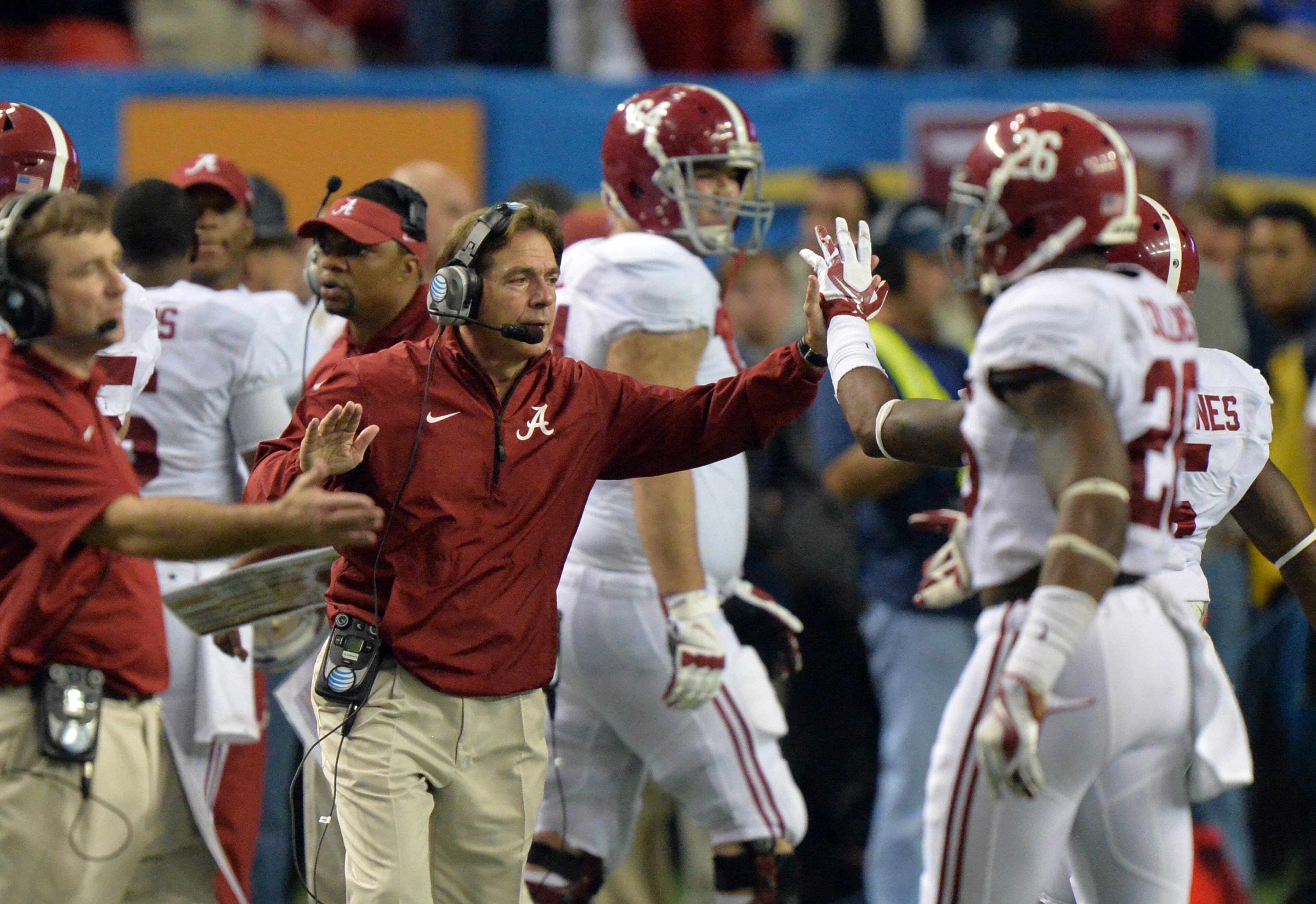 December 6, 2014 Atlanta:Alabama head coach Nick Saban high fives players during the 4th quarter against Missouri in the 2014 SEC Championship at the Georgia Dome Saturday December 6, 2014. BRANT SANDERLIN / BSANDERLIN@AJC.COM