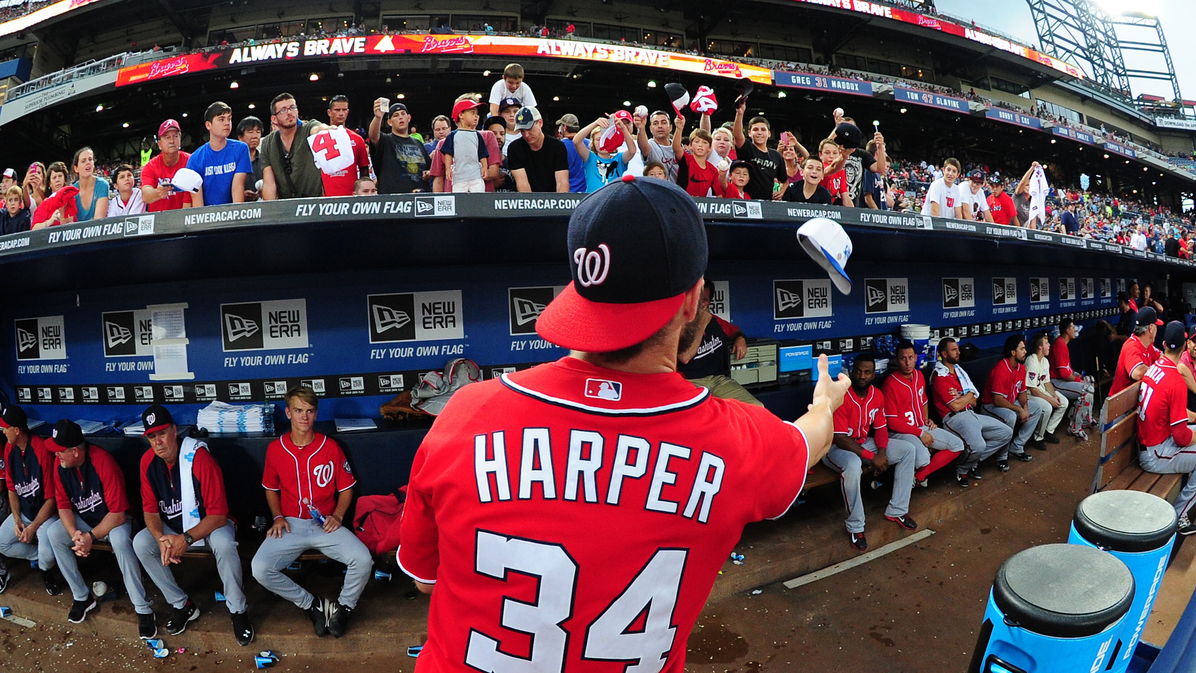 ATLANTA, GA - AUGUST 9: Bryce Harper #34 of the Washington Nationals signs autographs during a pregame rain delay against the Atlanta Braves at Turner Field on August 9, 2014 in Atlanta, Georgia. (Photo by Scott Cunningham/Getty Images)