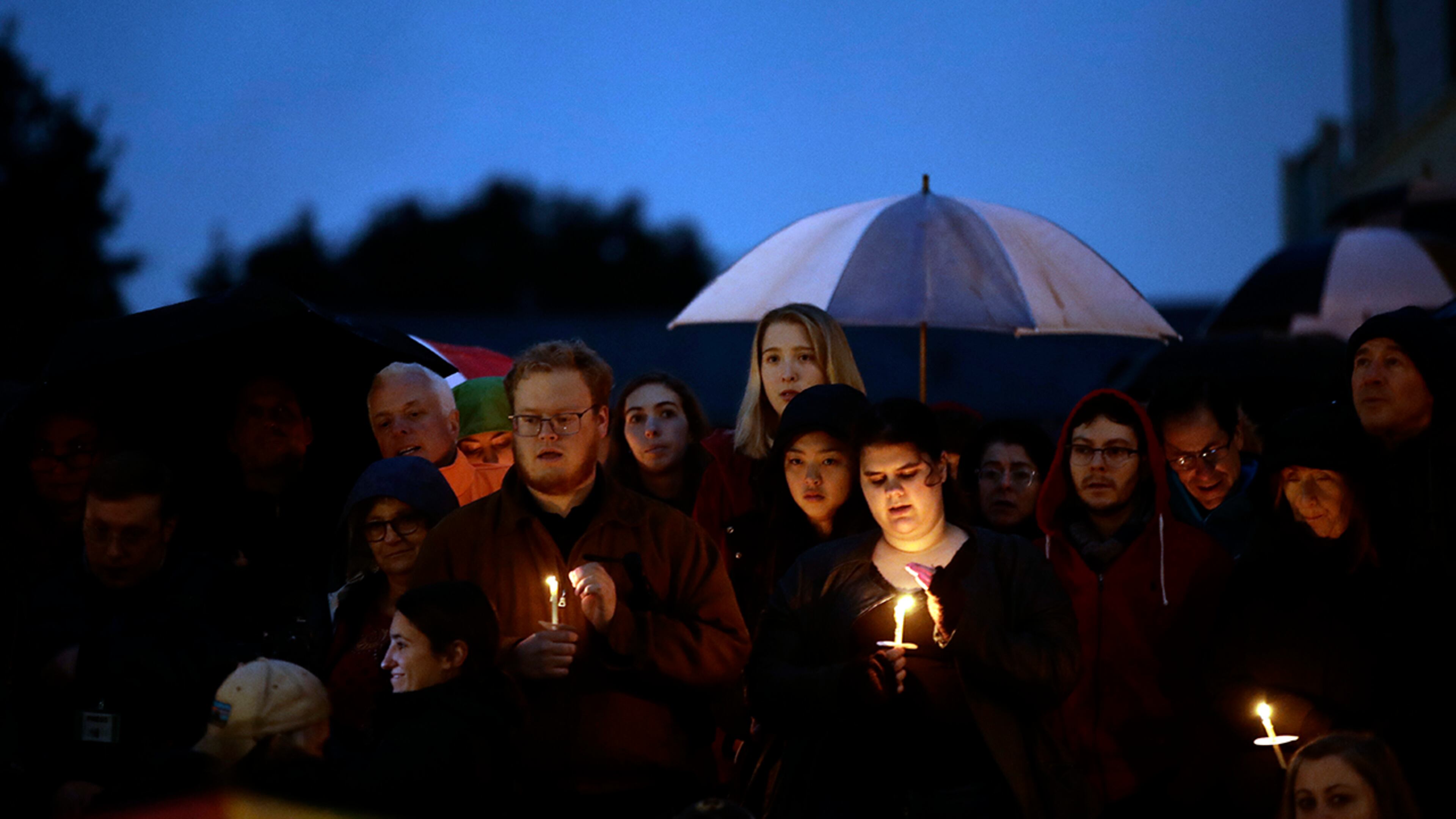 People hold candles as they gather for a vigil in the aftermath of a deadly shooting at the Tree of Life Congregation, in the Squirrel Hill neighborhood of Pittsburgh, Saturday, Oct. 27, 2018. (AP Photo/Matt Rourke)