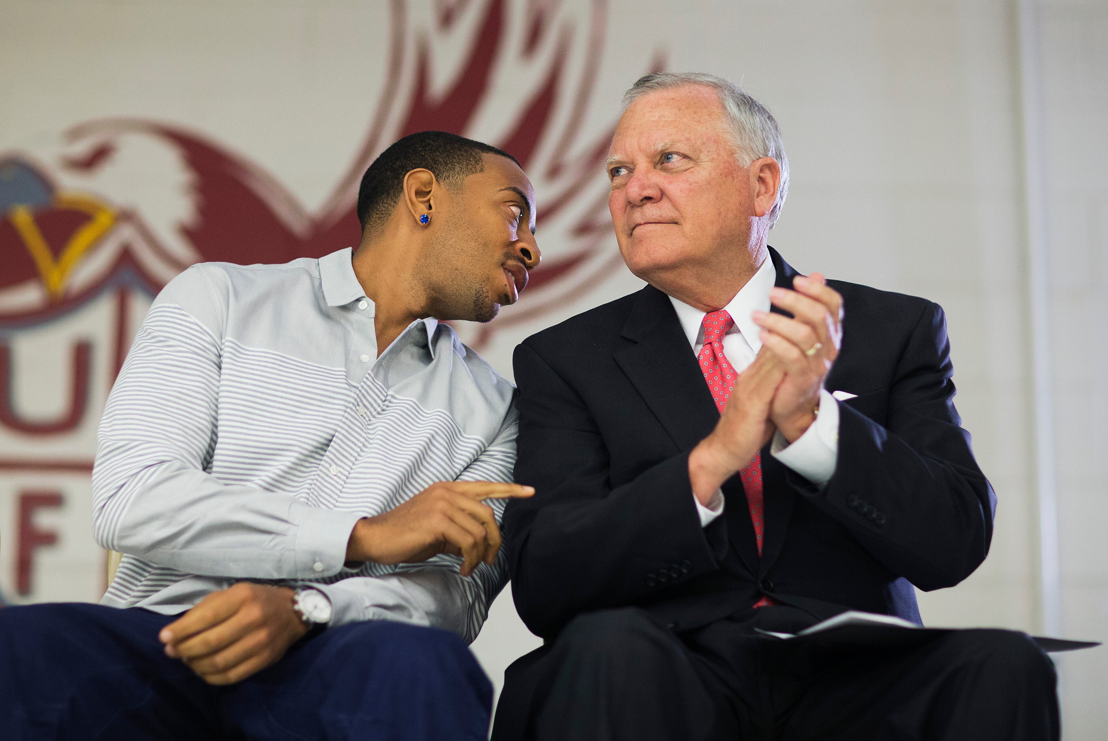 Rapper Ludacris, left, talks with Georgia Gov. Nathan Deal while visiting the charter school Utopian Academy for the Arts, Friday, Sept. 26, 2014, in Riverdale, Ga. Deal and Ludacris may seem like an odd pairing for a campaign event, but the duo was a hit with a cheering crowd of students Friday. Christopher "Ludacris" Bridges has been an outspoken supporter of President Barack Obama, penning a profane song during the 2008 campaign criticizing his opponents. But Deal says he couldn't think of anyone better to inspire students at the event. (AP Photo/David Goldman)