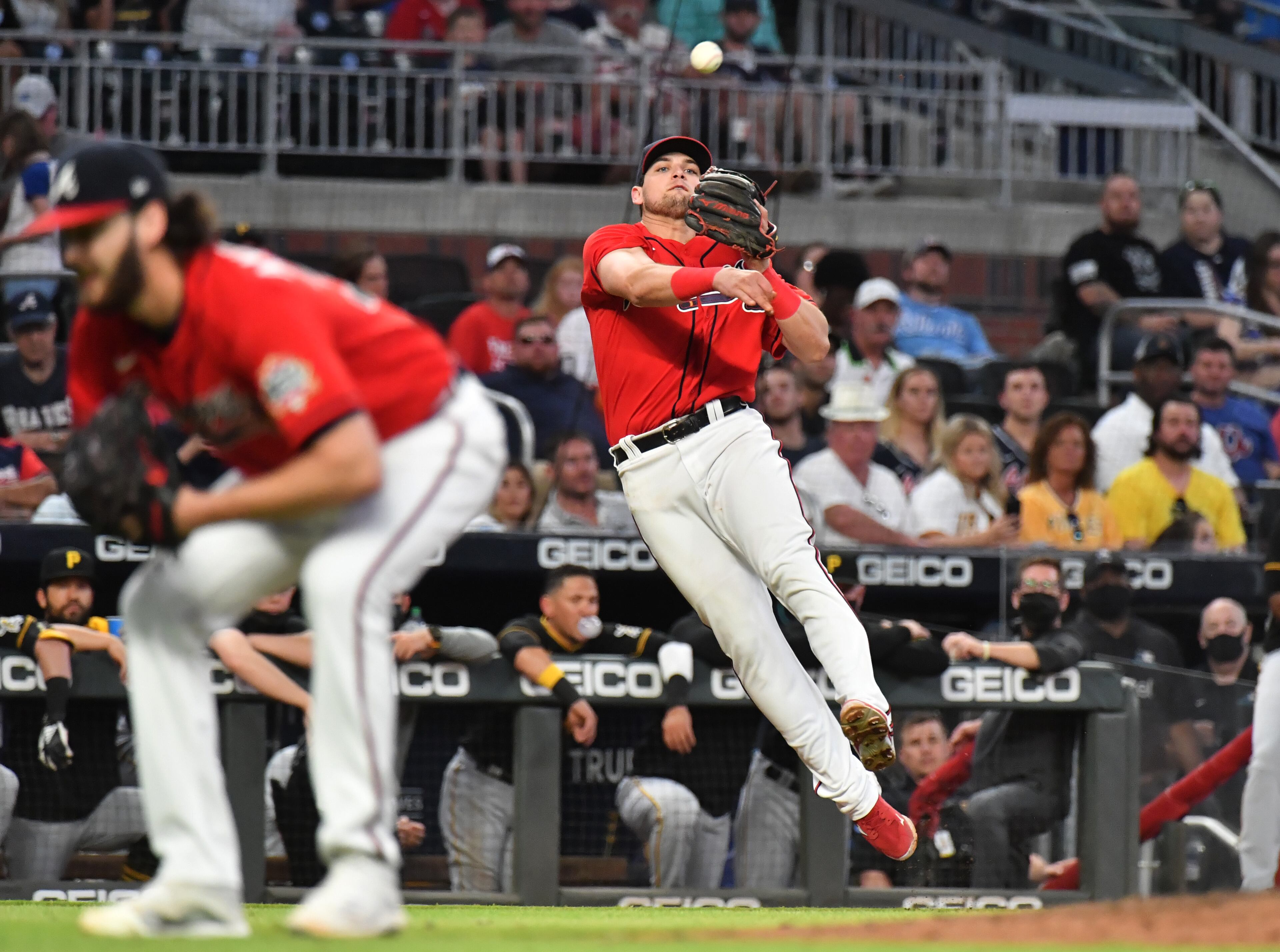 Braves third baseman Austin Riley throws to first base but can't get the out on Pittsburgh Pirates second baseman Erik Gonzalez in the 5th inning. (Hyosub Shin / Hyosub.Shin@ajc.com)
