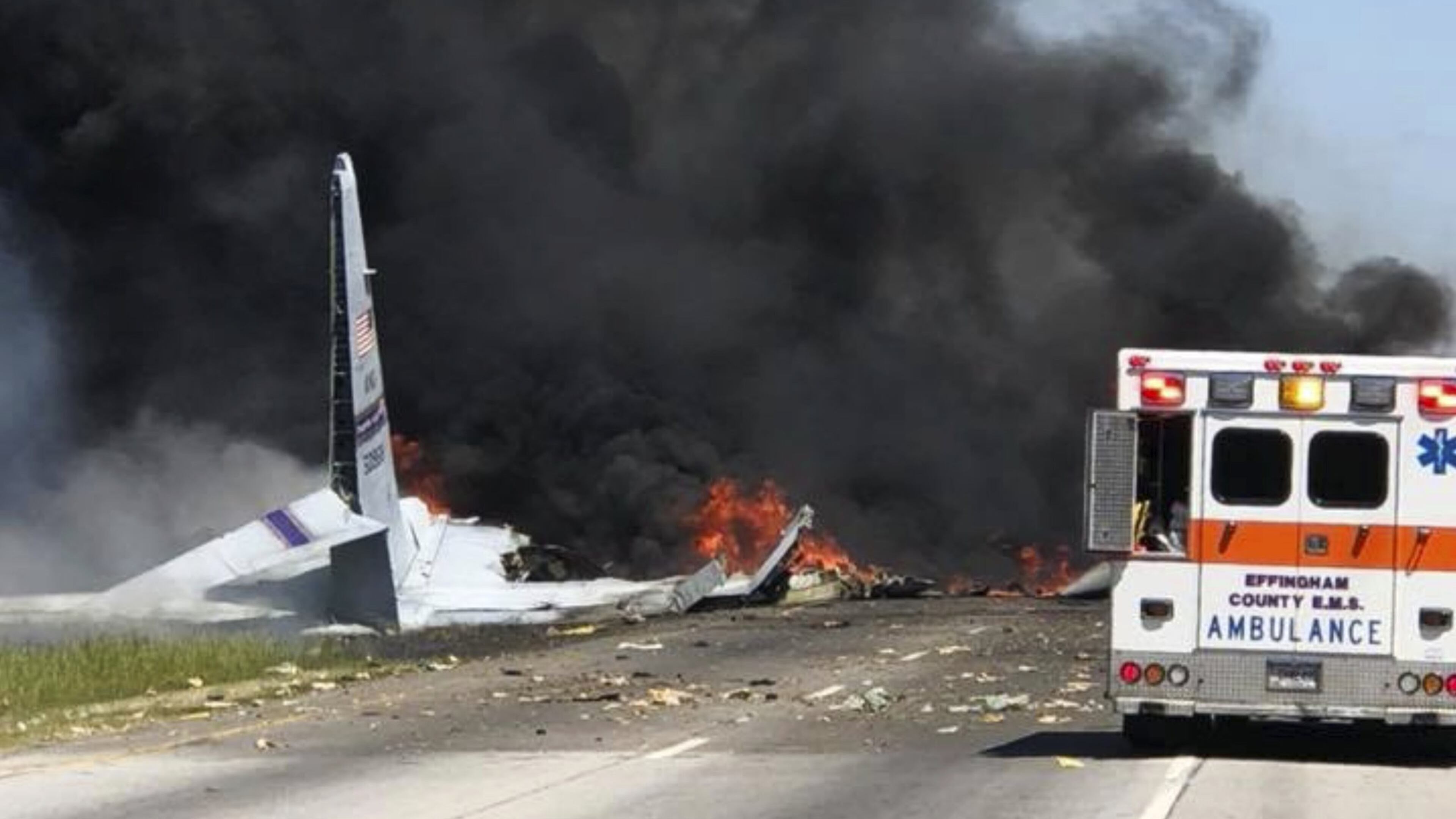 Flames and smoke rise from an Air National Guard WC-130 plane after it crashed near Savannah, Ga., Wednesday, May 2, 2018. (James Lavine via AP)