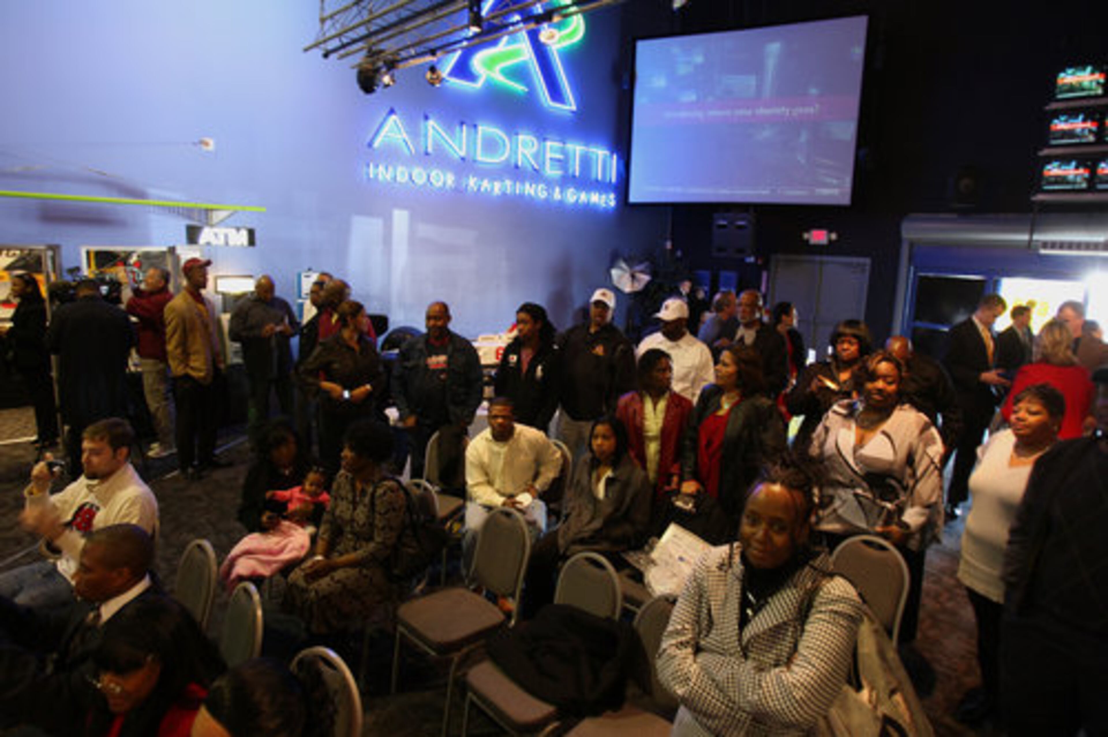 Family and friends gather to lend support during National Signing Day at the Andretti Indoor Karting & Games in Roswell Wednesday, February 3, 2010. The event is presented by Sports 680 The Fan.