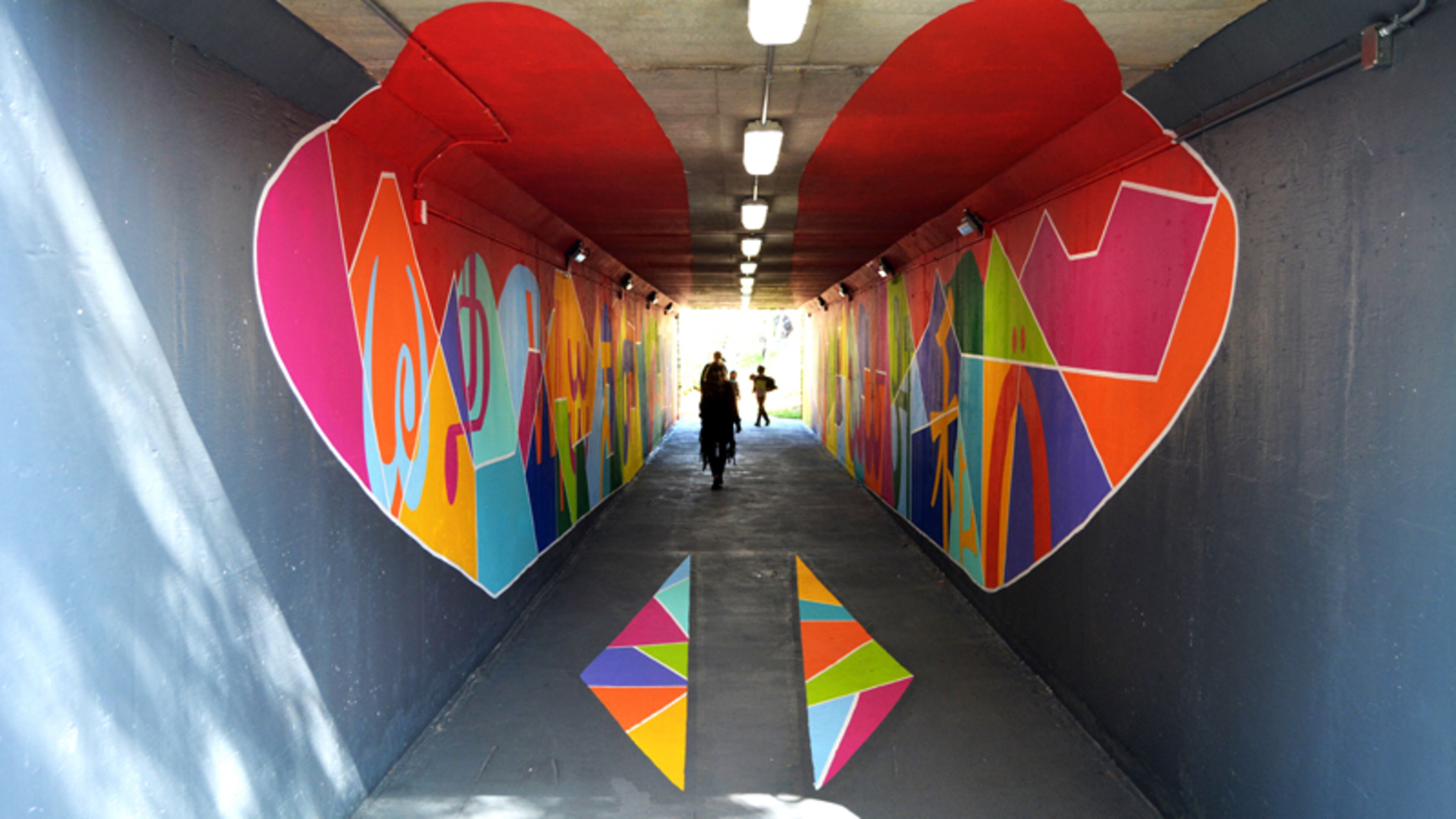 Johns Creek’s pedestrian tunnel under Medlock Bridge Road, with a mural completed earlier this year by artist Hanif Kureshi, will receive lights that will change colors through the year. CITY OF JOHNS CREEK