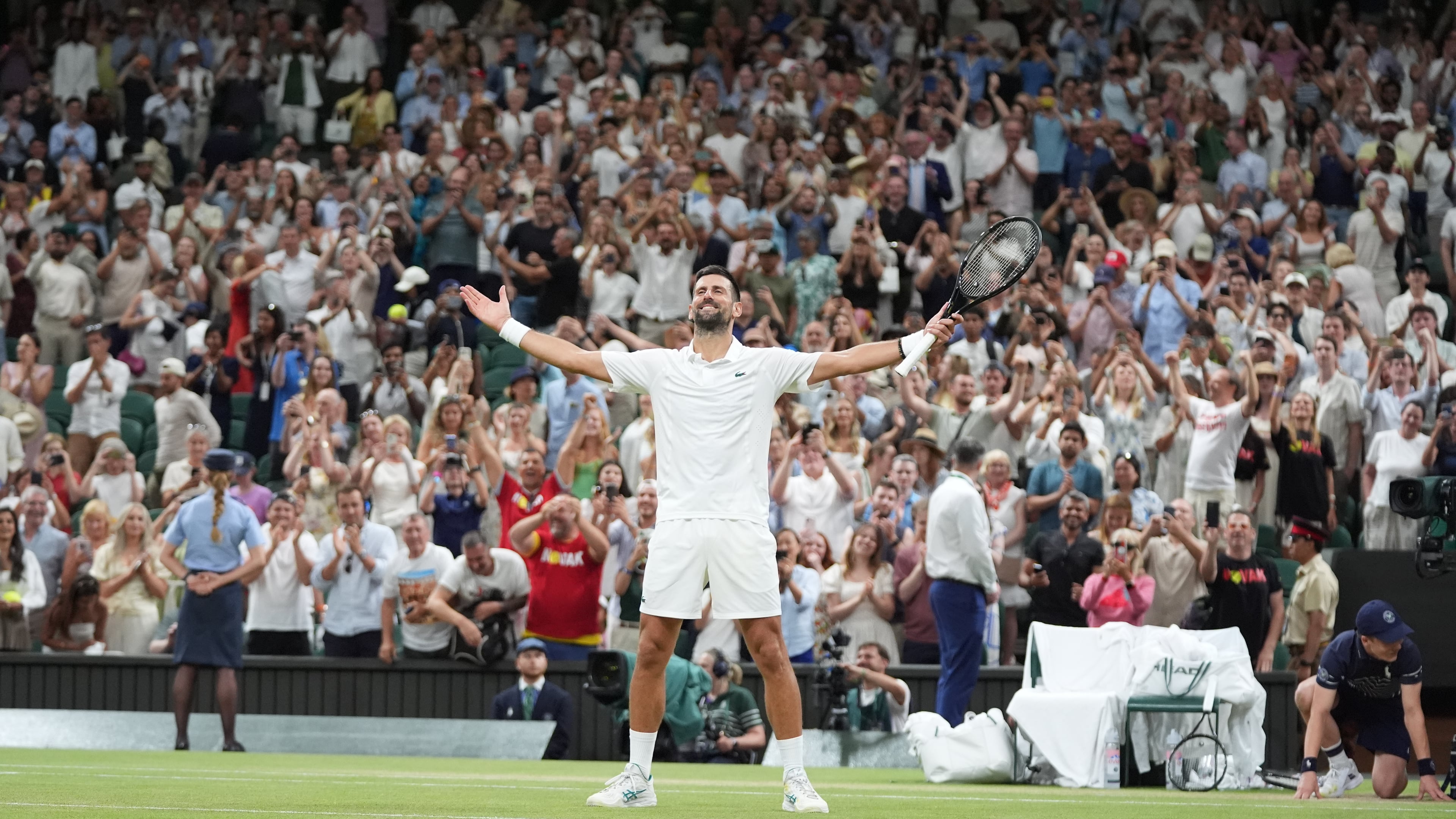 Novak Djokovic of Serbia celebrates winning against Felix Auger-Aliassime of Canada in their quarter-final men's singles match at the Wimbledon Tennis Championships in London, Tuesday, July 7, 2026. (AP Photo/Maja Smiejkowska)