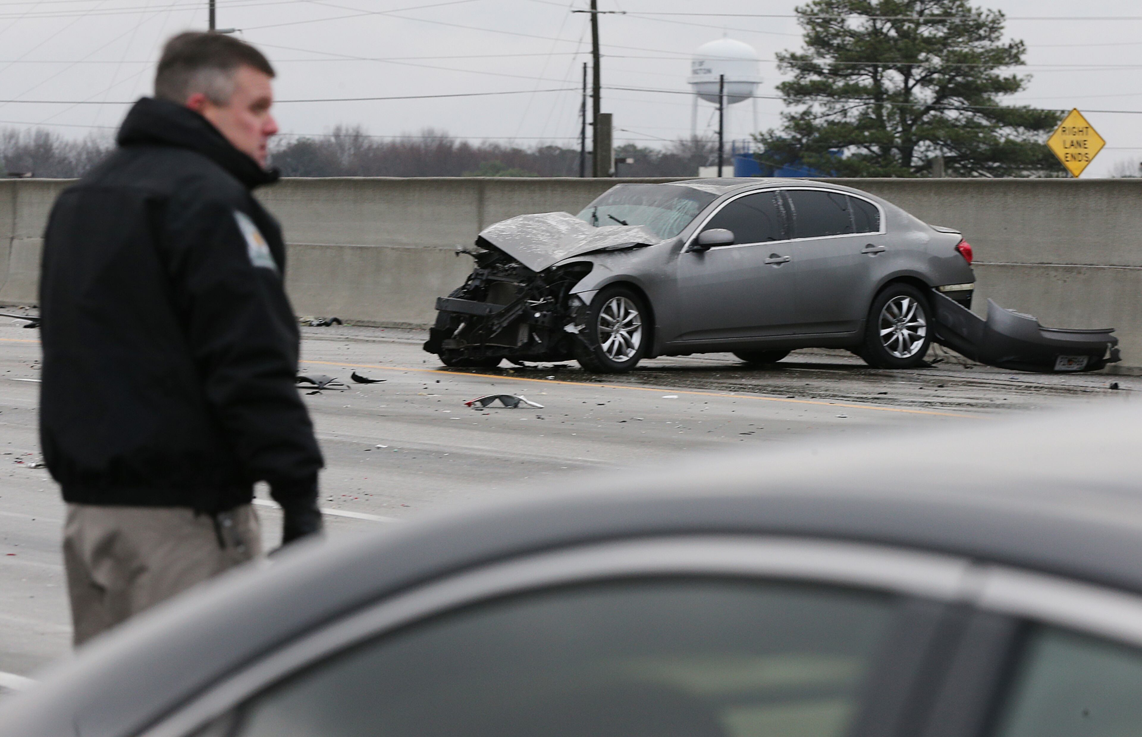 January 7, 2017, Covington: A Department of Natural Resources officer helps work the scene of a multi-vehicle accident on I-20 West at Alcovy Road on an icy bridge overpass as temperatures drop below freezing on Saturday, Jan. 7, 2017, in Covington. Curtis Compton/ccompton@ajc.com