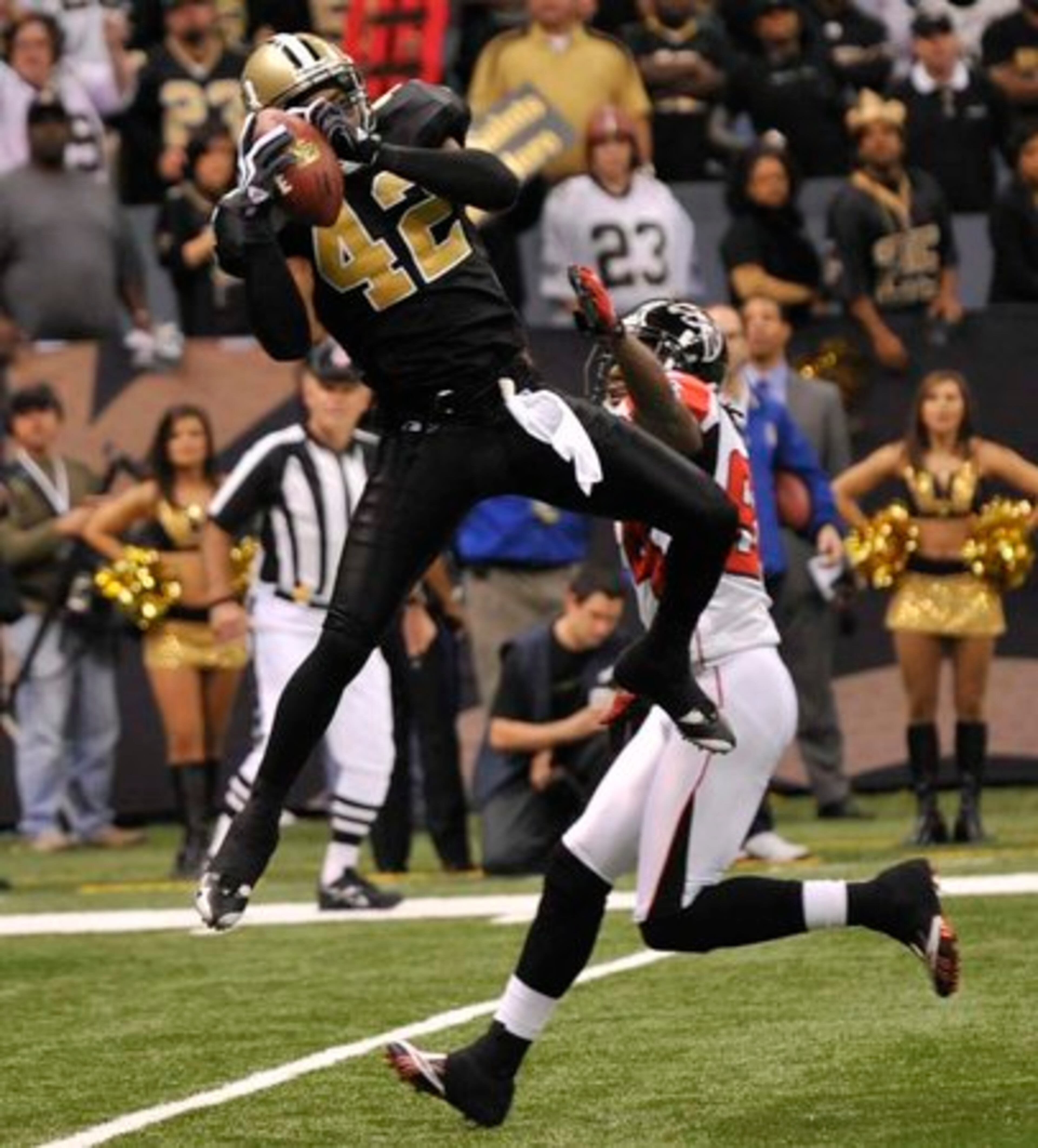 Saints safety Darren Sharper (42) intercepts a Hail Mary pass in front of Falcons wide receiver Roddy White (84) in the closing seconds of the Saints' 35-27 win over the Falcons.