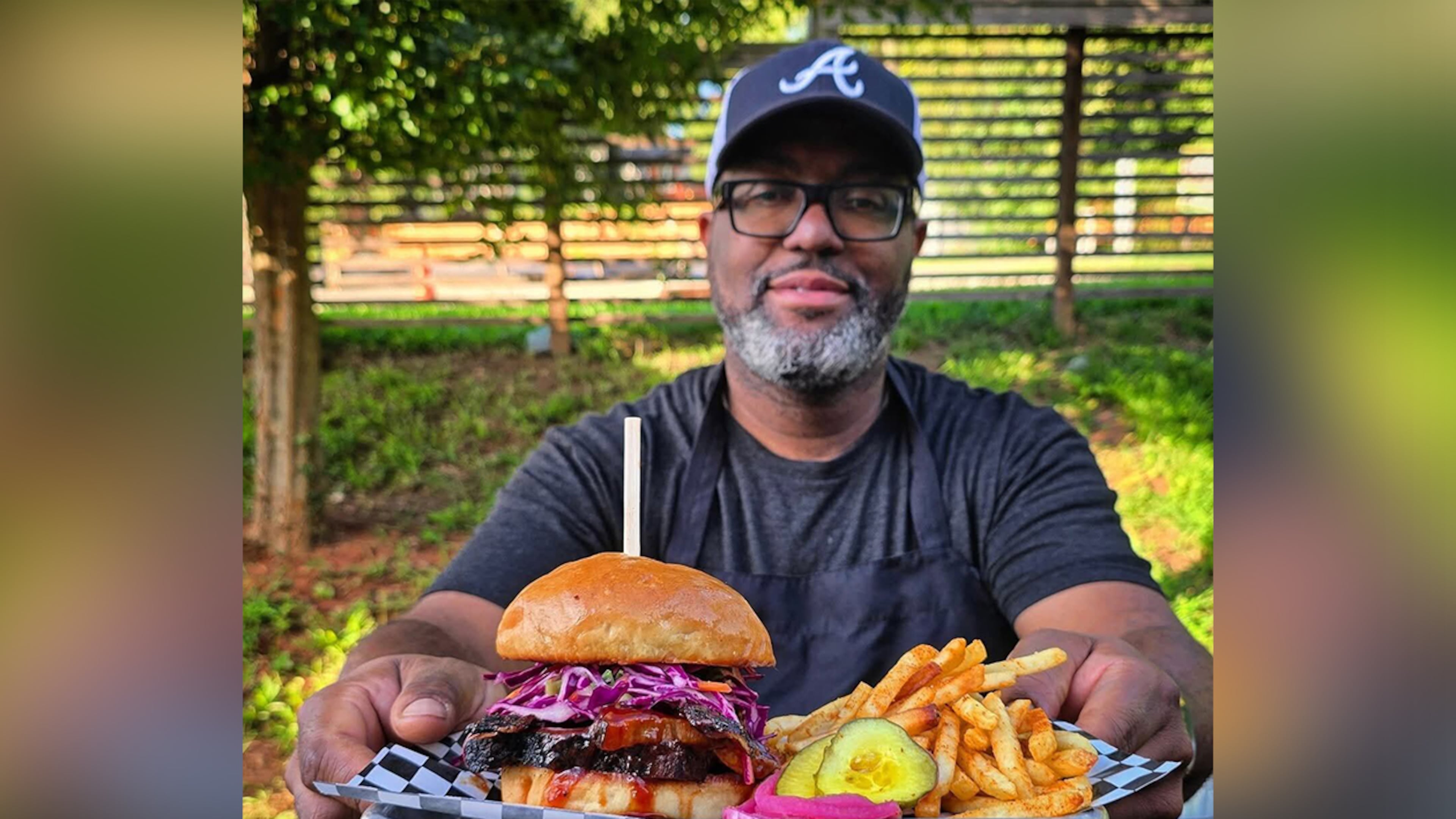 Jimmie Jackson of Jimmie's Jerk Barbecue and his brisket sandwich. (Courtesy of Jimmie's Jerk Barbecue)