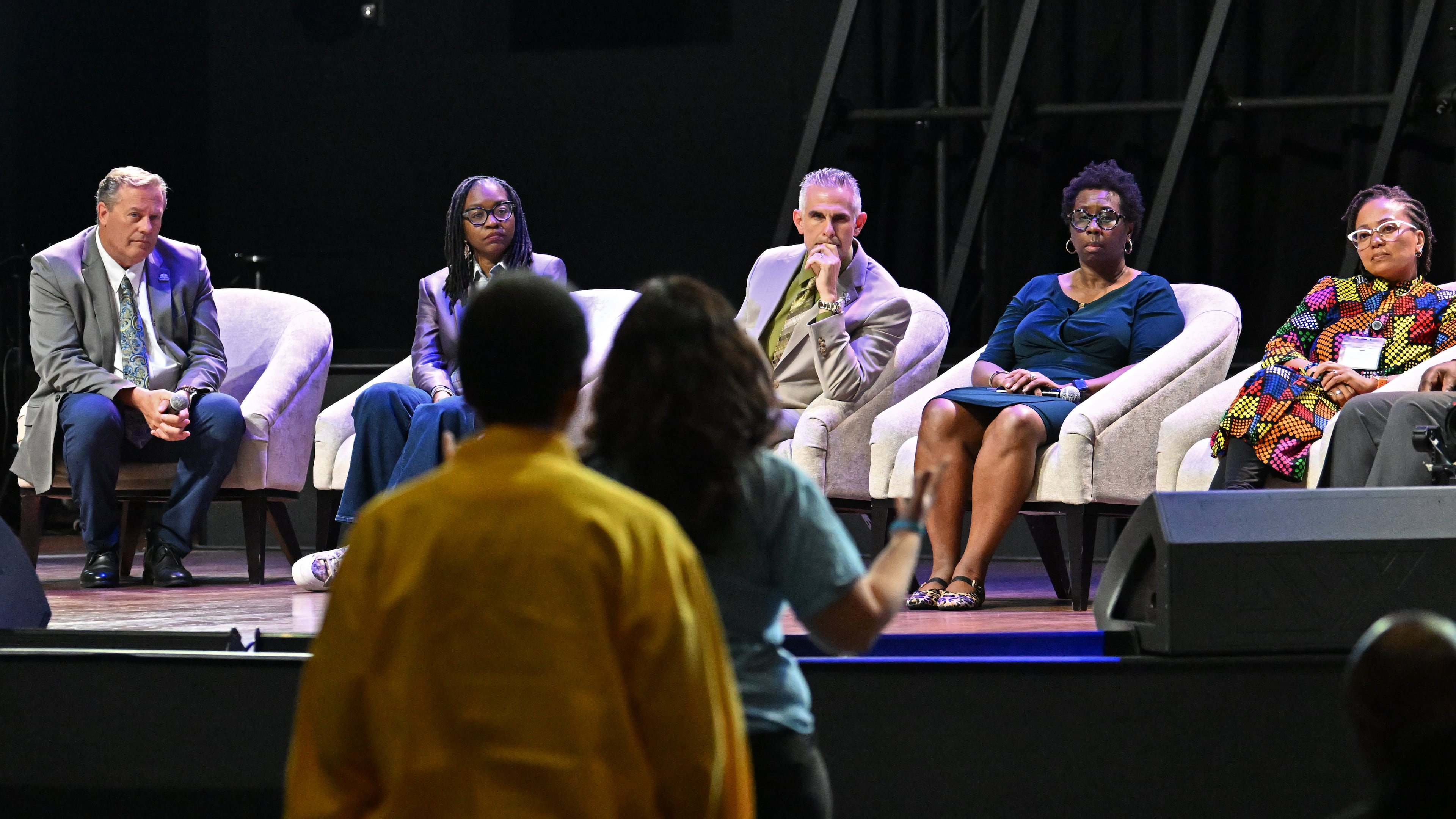 DeKalb County school administrators listen during a public comment session during a community meeting to discuss possible DeKalb school closures on Tuesday, April 28, 2026, at New Life Church in Decatur. (Hyosub Shin/AJC)