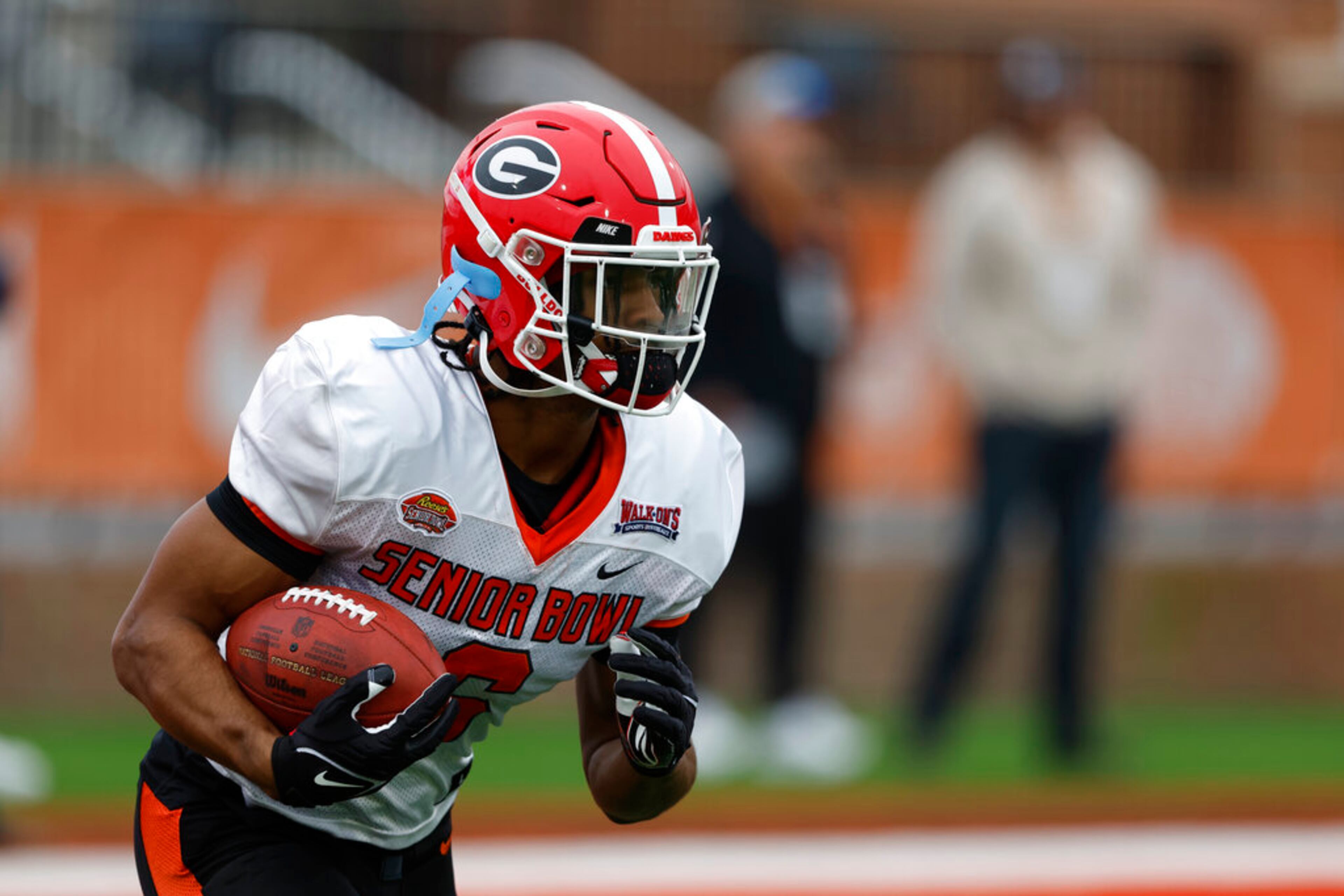 American running back Kenny McIntosh of Georgia (6) runs through drills during practice for the Senior Bowl NCAA college football game Thursday, Feb. 2, 2023, in Mobile, Ala.. (AP Photo/Butch Dill)