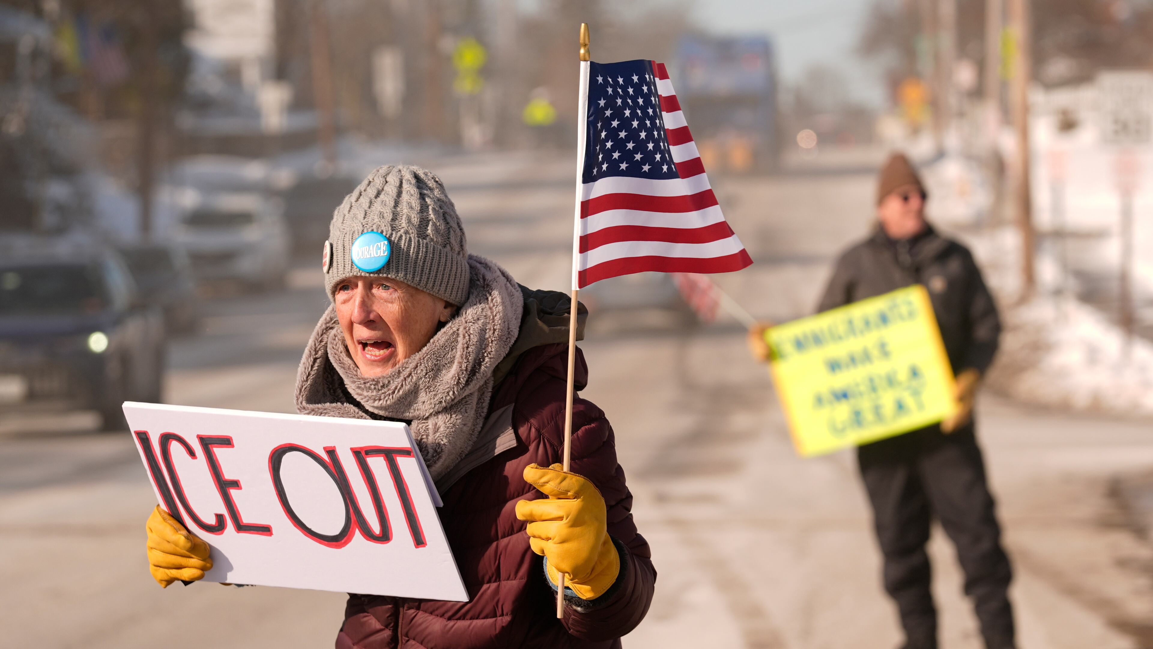 Rosie Grutze protests the presence of the U.S. Immigration and Customs Enforcement, Wednesday, Jan. 21, 2026, in Portland, Maine. (AP Photo/Robert F. Bukaty)