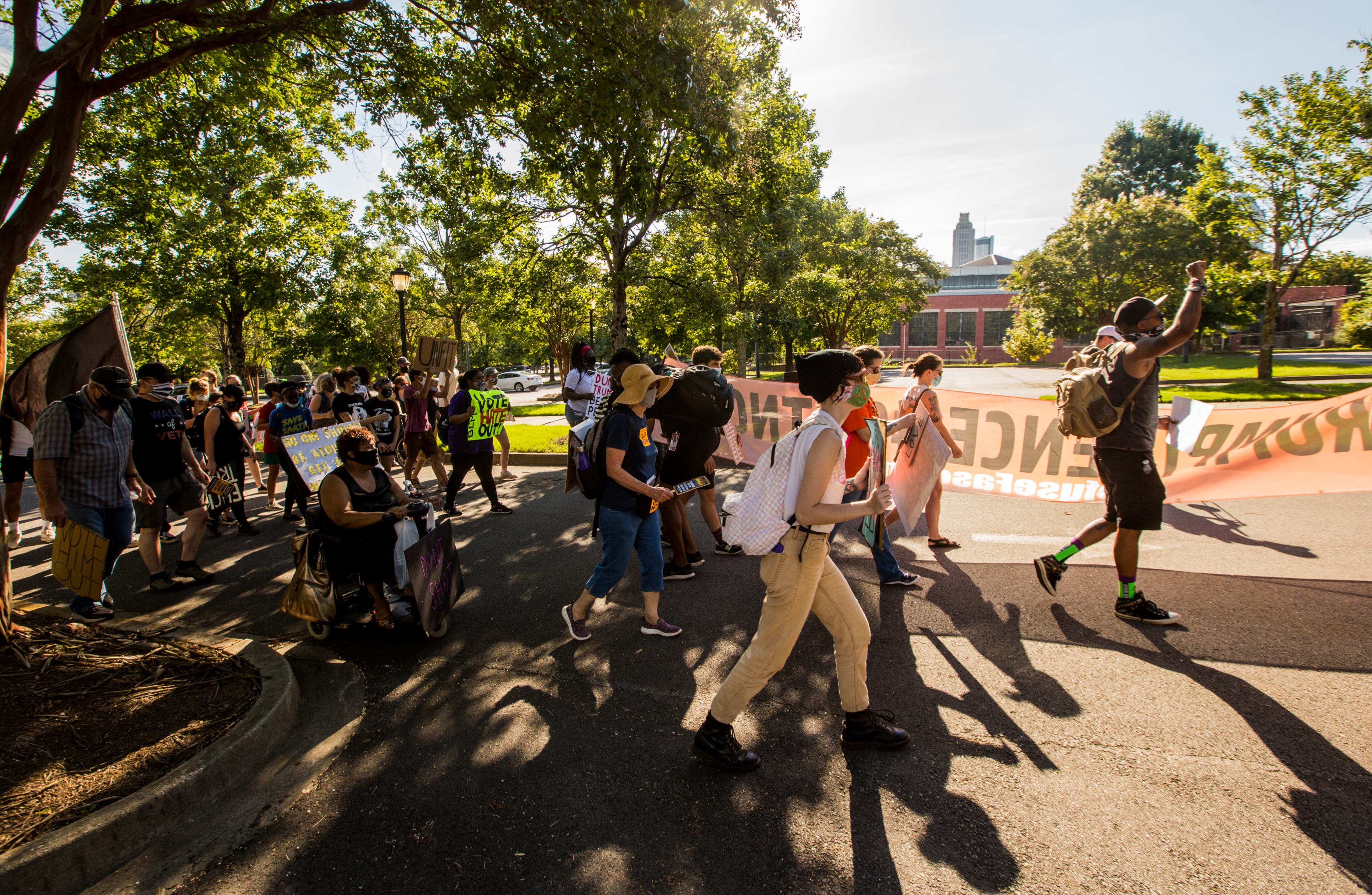 Protesters march from a parking lot behind Ebenezer Baptist Church and marched toward CNN Center on Saturday, September 5, 2020. The protest started at Ebenezer Baptist Church as a political gathering and joined a Black Lives Matter protest at the CNN Center with a heavy police escort along the way. (Jenni Girtman for The Atlanta Journal-Constitution)