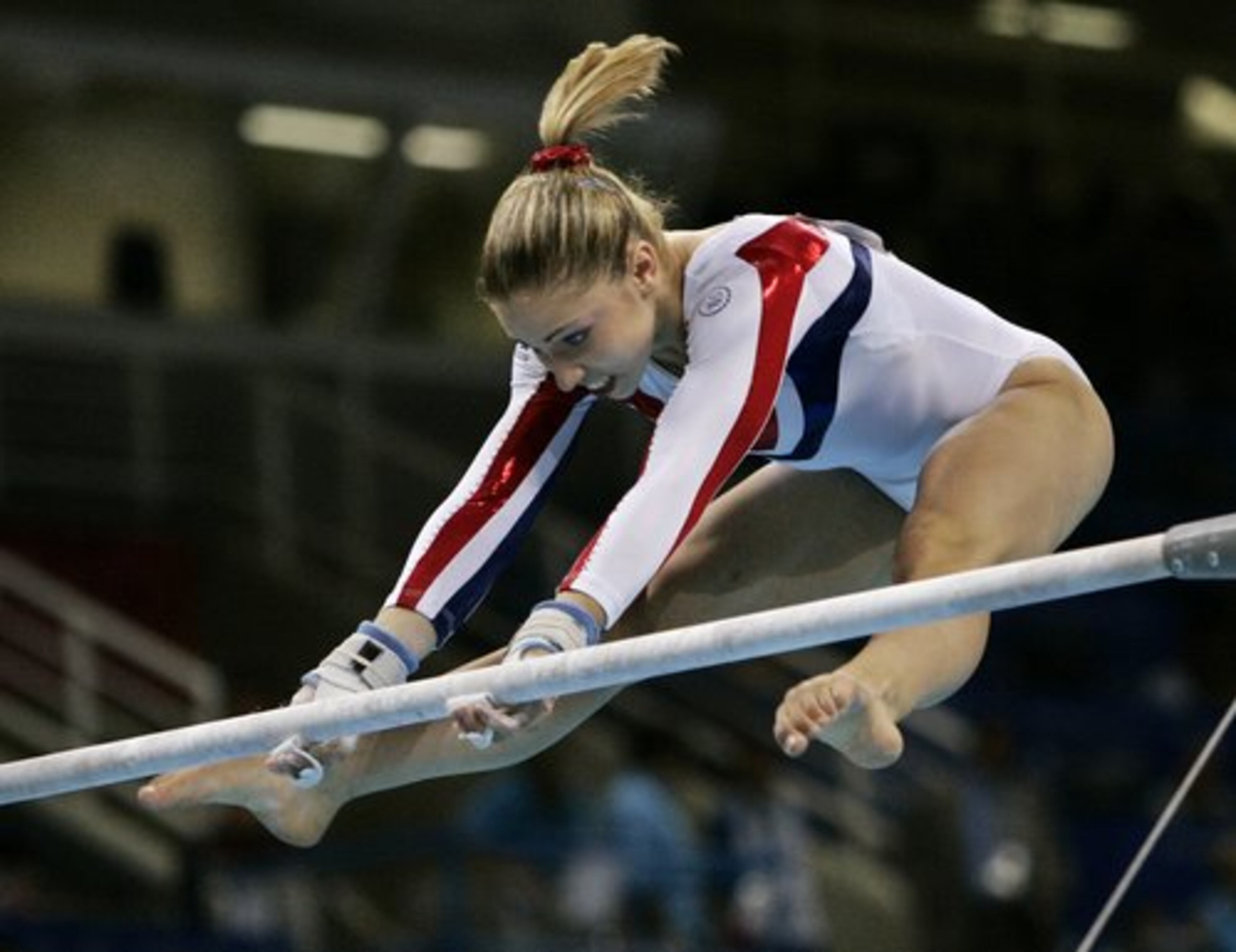 At the 2004 Olympics (above), Kupets was on the U.S. team that won a silver medal in the all-around competition. She also won an individual bronze medal on bars.