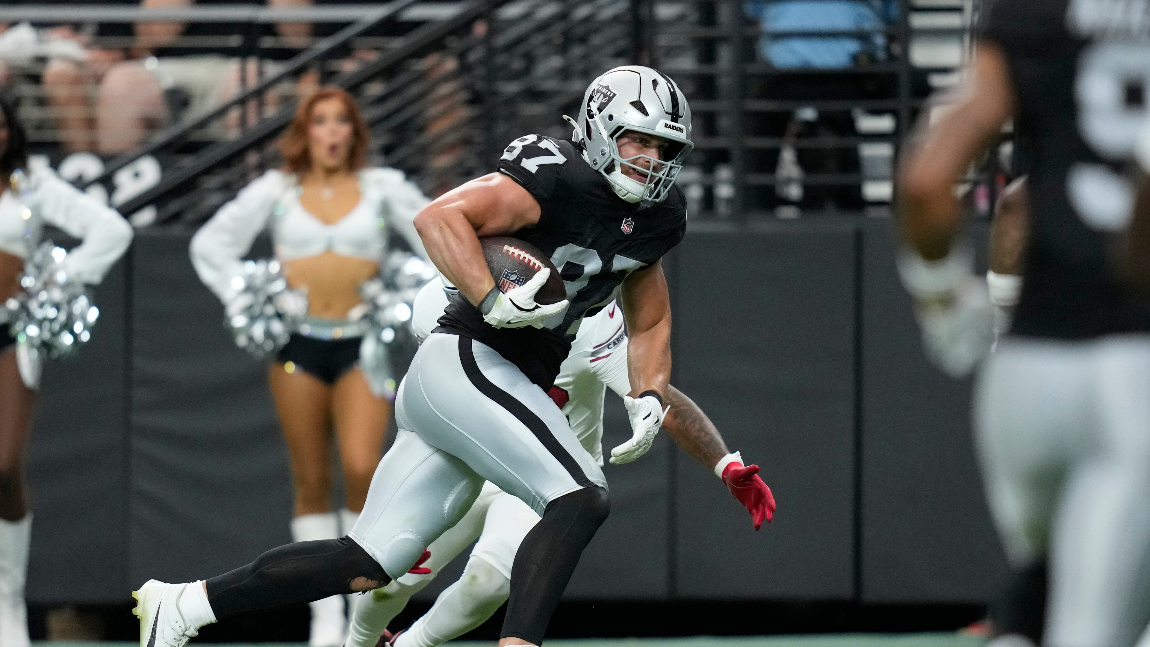 Las Vegas Raiders tight end Michael Mayer breaks away from the Arizona Cardinals defense to score a touchdown during the first half of a preseason NFL football game, Thursday, Aug. 13, 2026, in Las Vegas. (AP Photo/John Locher)