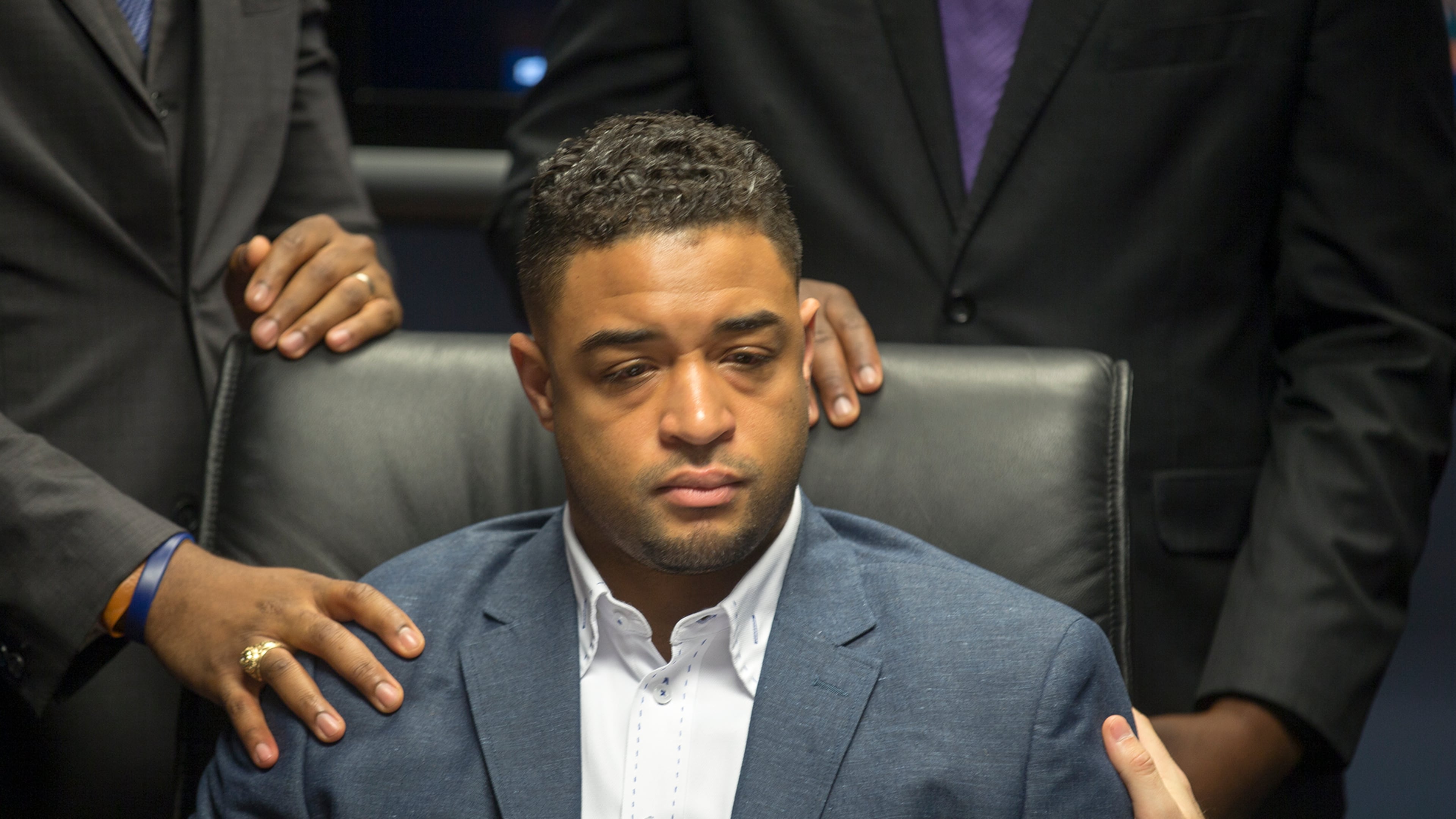 Pastor Jordan Brown takes a moment to compose himself as he is overcome with emotion during a press conference in April as he speaks about how he felt when he saw a gay slur on a cake he had ordered from Whole Foods. Pastor Jordan Brown and his attorney Austin Kaplan filed a law suit against Whole Foods. RICARDO B. BRAZZIELL/AMERICAN-STATESMAN