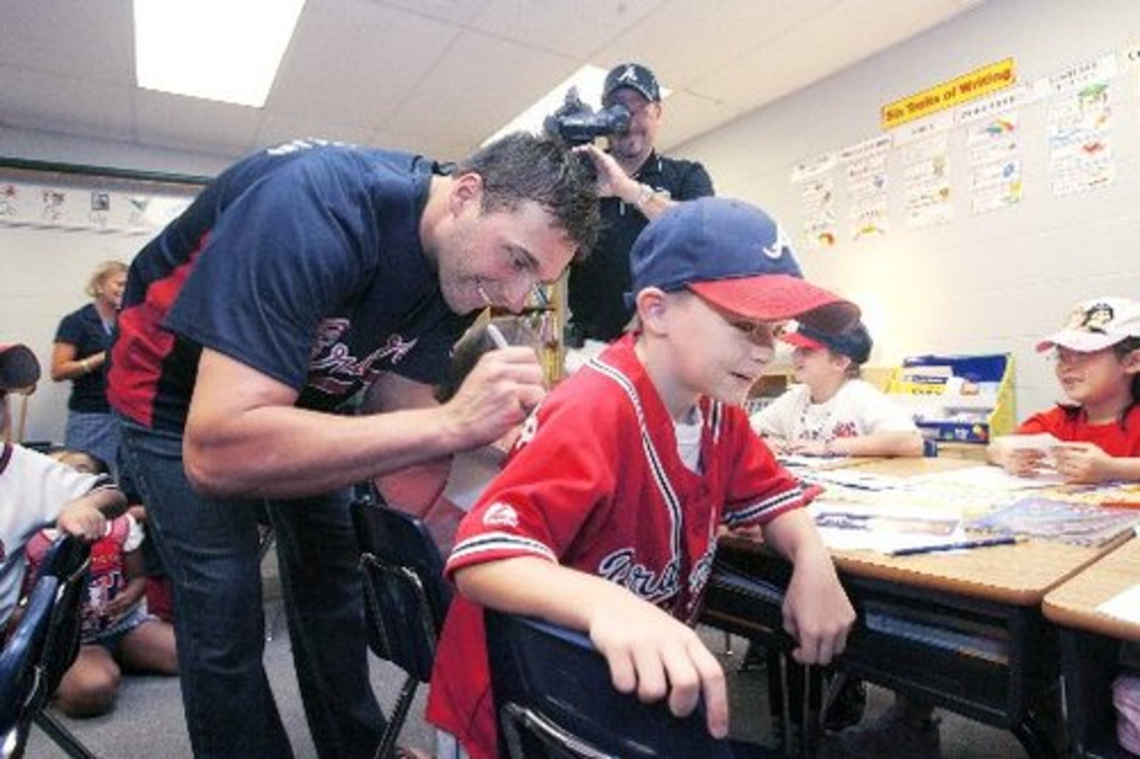 Francoeur had the back of second grader Sean Johnson, who wanted his Braves replica jersey signed.