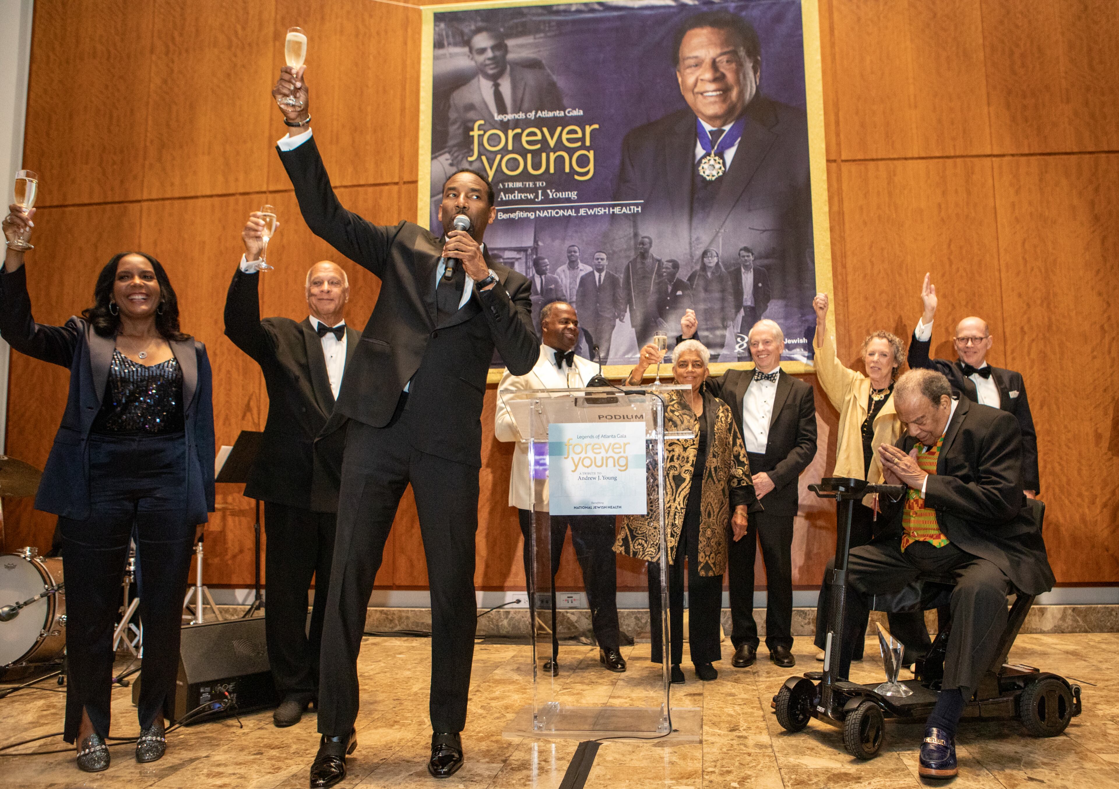 All living Atlanta Mayors honored Andrew Young, front right, including current Mayor Andre Dickens, front left, toasting Young with Mayors Keisha Lance Bottoms, from left back, Bill Campbell, Kasim Reed and Shirley Franklin.