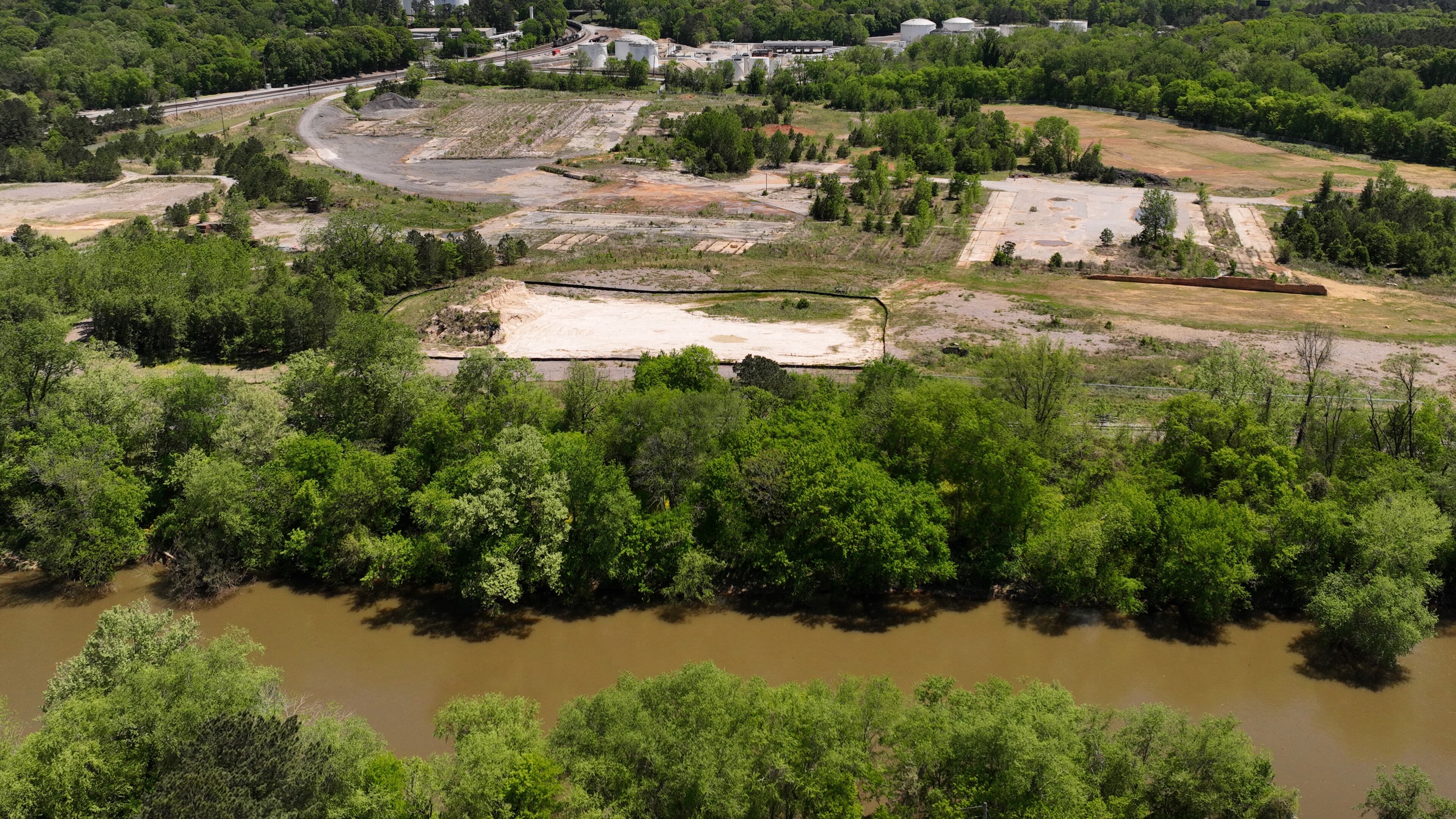 April 19, 2022 Atlanta - Aerial photograph shows Chattahoochee Brick Company on Tuesday, April 19, 2022. A year and a half ago, a massive swath of land near the banks of the Chattahoochee River was on track to becoming a fuel terminal to move ethanol, oil and other commodities from train cars. With a vote by the Atlanta City Council on Monday, that land is now slated to become a 75-acre park with a memorial to historical atrocities that occurred there. (Hyosub Shin / Hyosub.Shin@ajc.com)