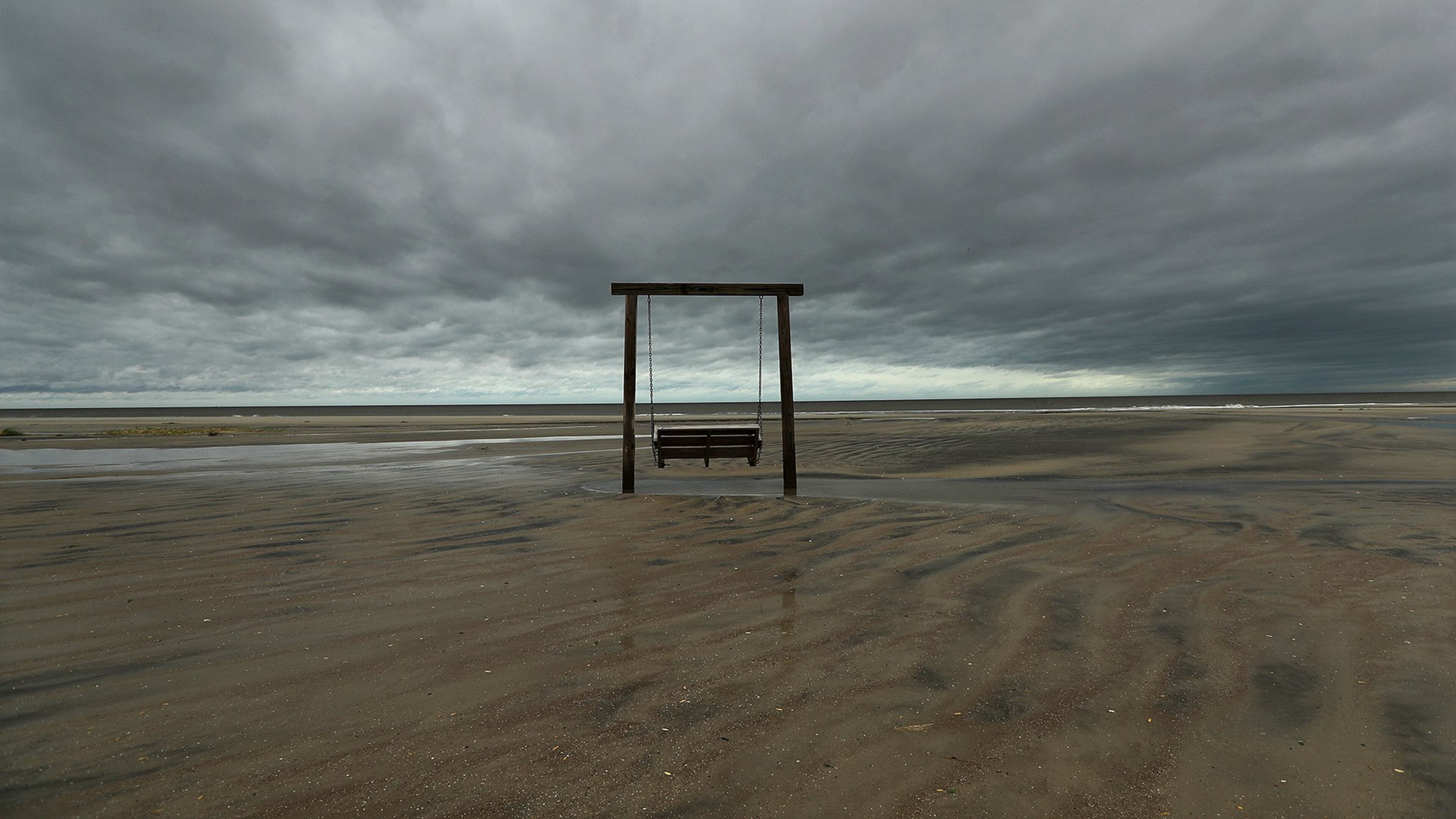 The beach on the northern end of Tybee Island and the sand dunes have suffered signifcant erosion, but a solitary swing remains, as the remnant of Hurricane Matthew passes by on Saturday, Oct. 8, 2016, in Tybee Island. Curtis Compton /ccompton@ajc.com
