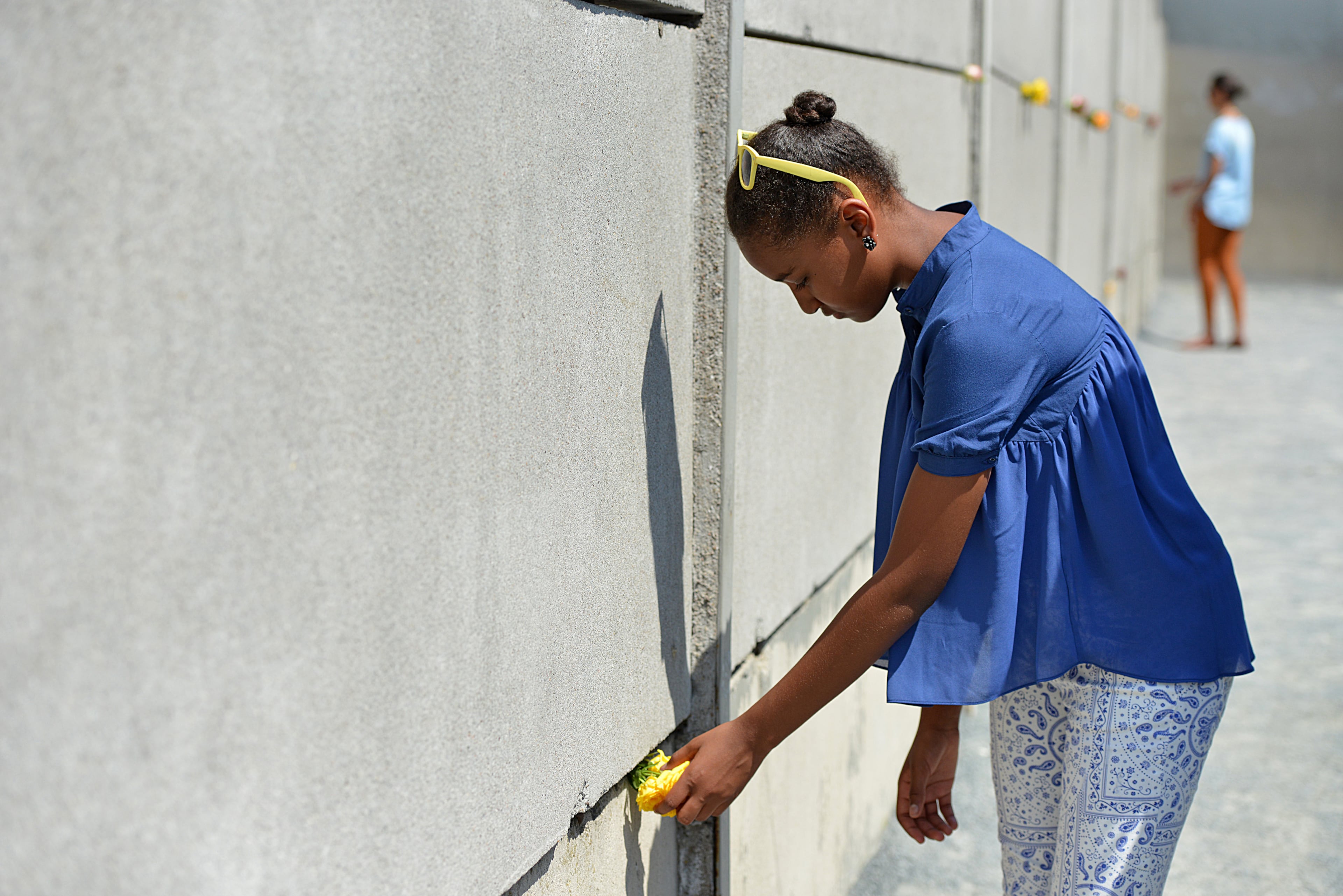 Sasha Obama visits the Berlin Wall memorial at Bernauer Strasse on June 19, 2013 in Berlin, Germany. U.S. President Barack Obama is visiting Berlin for the first time during his presidency and his speech at the Brandenburg Gate is to be the highlight. Obama will be speaking close to the 50th anniversary of the historic speech by then U.S. President John F. Kennedy in Berlin in 1963, during which he proclaimed the famous sentence: Ich bin ein Berliner. (Photo by Miriam May - Pool /Getty Images)