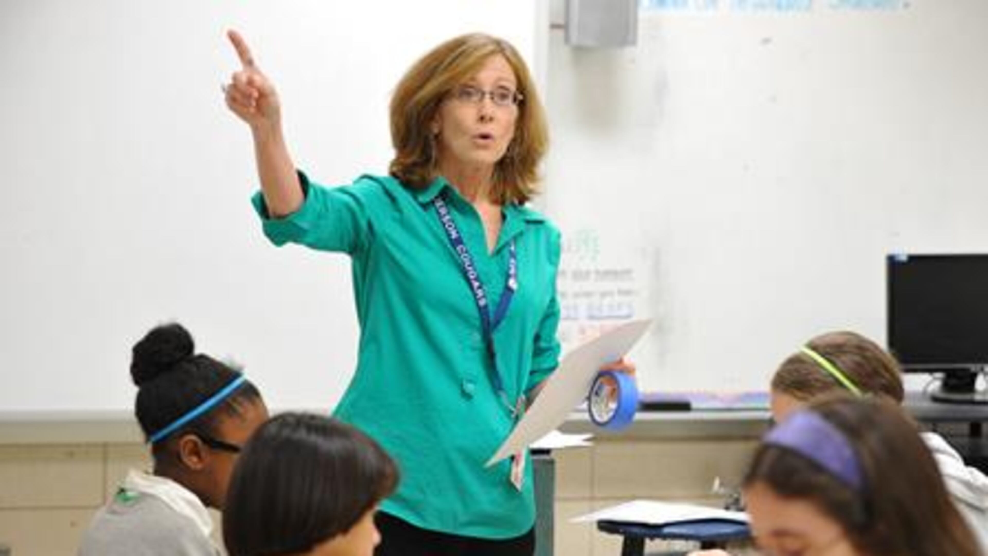 May 15, 2014 Atlanta - Paula Moore, math teacher, teaches her classs at Henderson Middle School in Atlanta on Thursday, May 15, 2014. In 2006, Georgia education officials touted the growing numbers of minority and disadvantaged students flowing into gifted classes. But an analysis by The Atlanta Journal-Constitution shows black students still lag significantly behind their white counterparts in gifted programs. And the gap is wide when it comes to poor students. HYOSUB SHIN / HSHIN@AJC.COM Georgia plans to assess teachers based on student growth, but are we clear on what growth really means? HYOSUB SHIN / HSHIN@AJC.COM