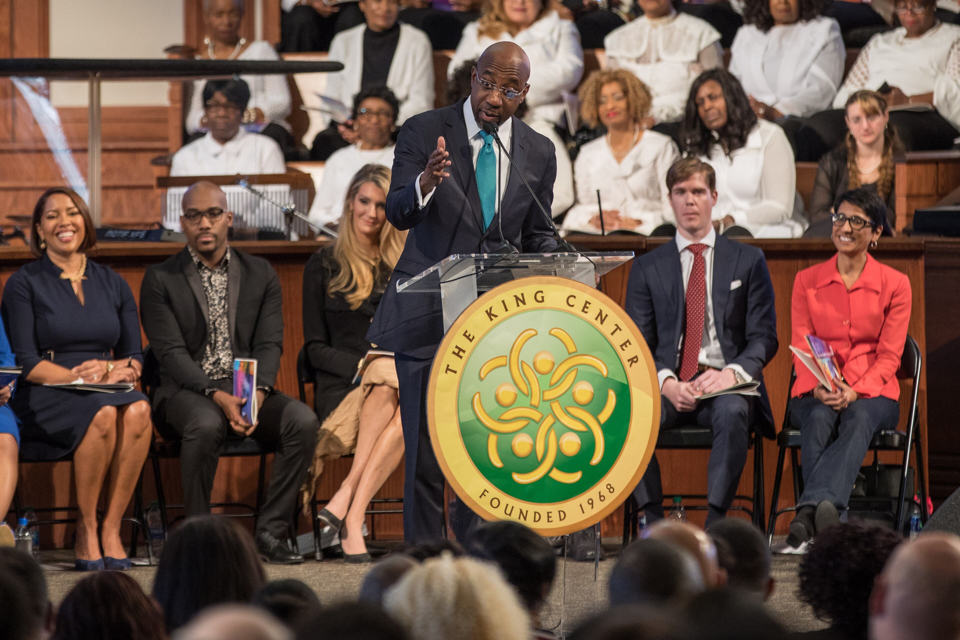 The Rev. Raphael G. Warnock speaks during the Martin Luther King Jr. annual commemorative service at Ebenezer Baptist Church in Atlanta on Monday, Jan. 20, 2020. Behind him at left is U.S. Sen. Kelly Loeffler, whom Warnock would announce later in the month he would be challenging for her new seat. BRANDEN CAMP/SPECIAL