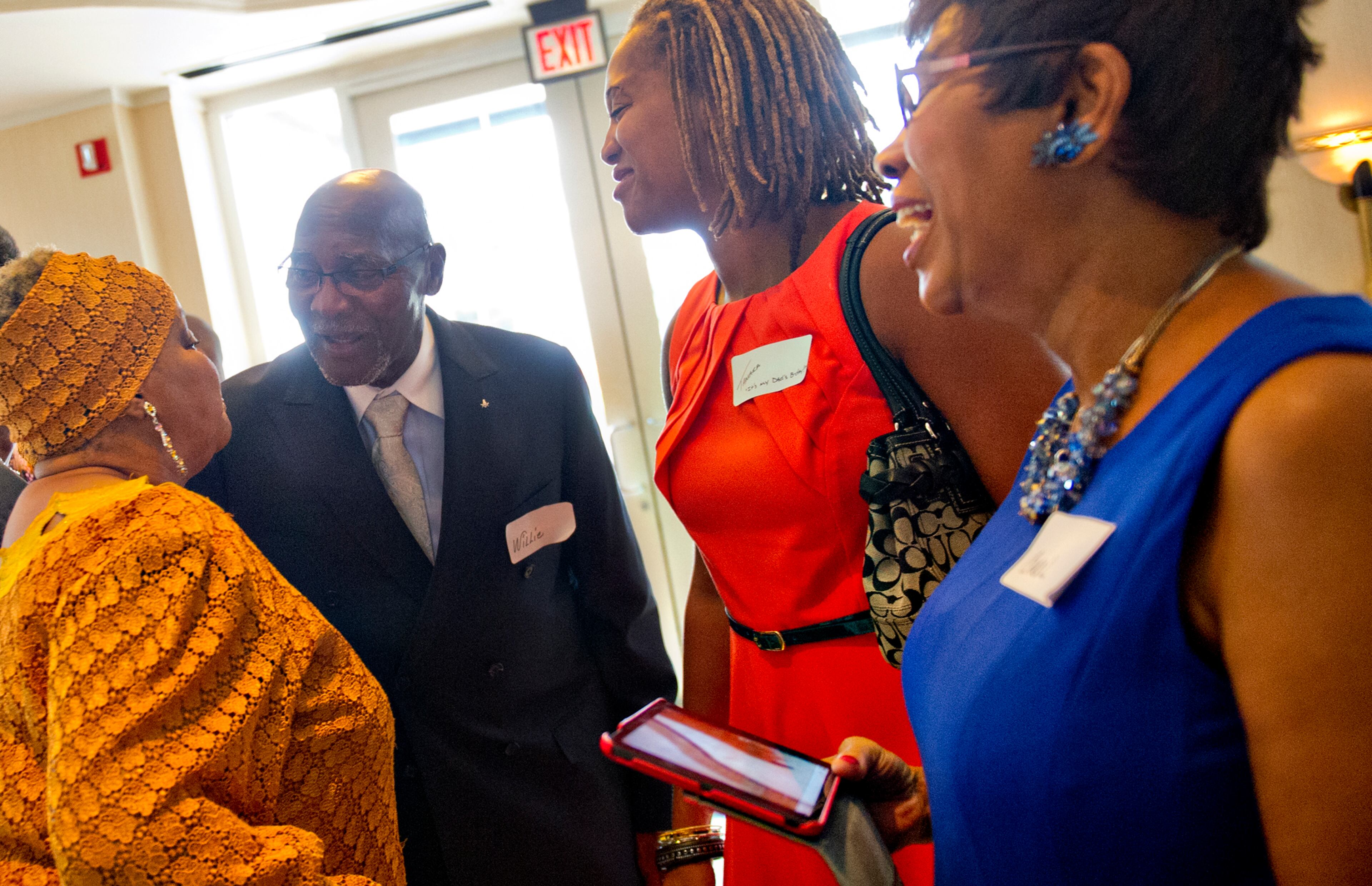 September 15, 2013 Atlanta - Willie H. Fowler (center), his daughter Tamara and wife Carol (right) socialize with Elisabeth Omilami during the first annual Fowler Family Celebration of Love at Villa Christina in Atlanta on Sunday, September 15, 2013. Put together by Willie H. Fowler, his family and the Hosea Feed the Hungry organization, the dinner came about after cancelled wedding plans were transformed into an opportunity to feed 200 homeless individuals and families. JONATHAN PHILLIPS / SPECIAL