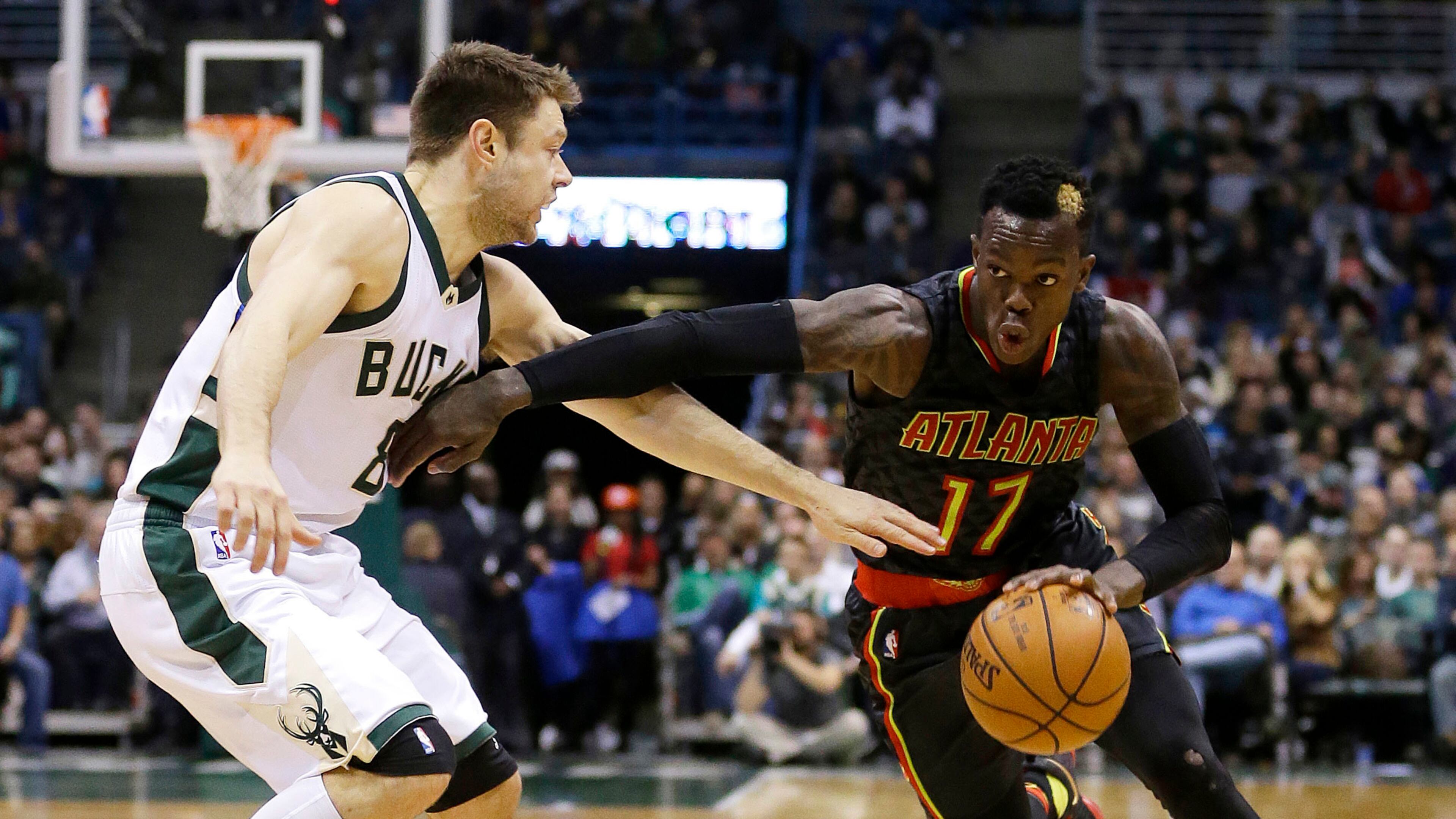 Atlanta Hawks’ Dennis Schroder (17) drives to the basket against Milwaukee Bucks’ Matthew Dellavedova during the second half of an NBA basketball game Friday, Dec. 9, 2016, in Milwaukee. The Hawks won 114-110. (AP Photo/Aaron Gash)