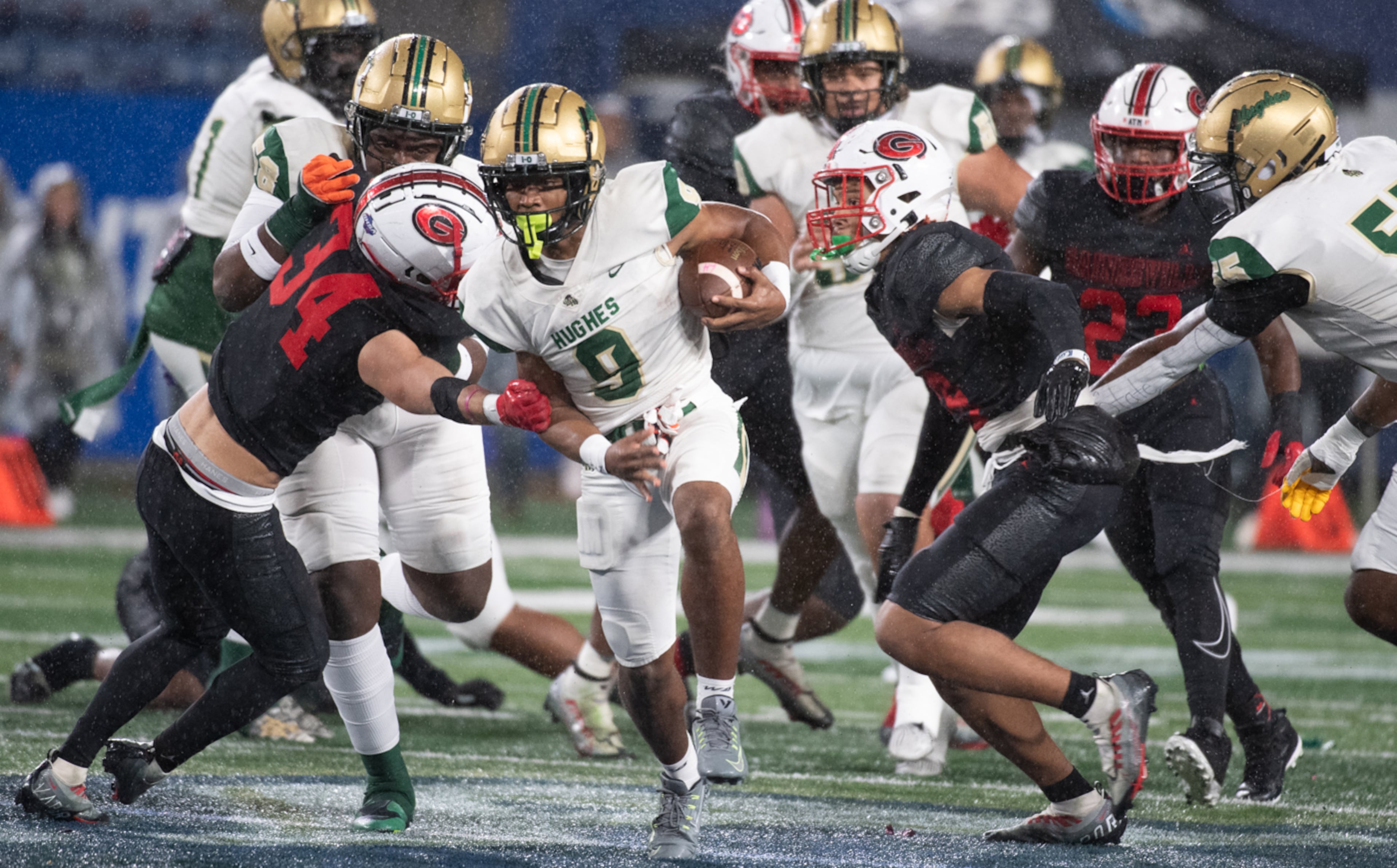 Jekail Middlebrook of Langston Hughes breaks through the pack during the Hughes vs Gainesville High School football game on Friday, Dec. 9, 2022, at the Georgia State Stadium in Atlanta, Georgia. (Jamie Spaar for the Atlanta Journal Constitution)