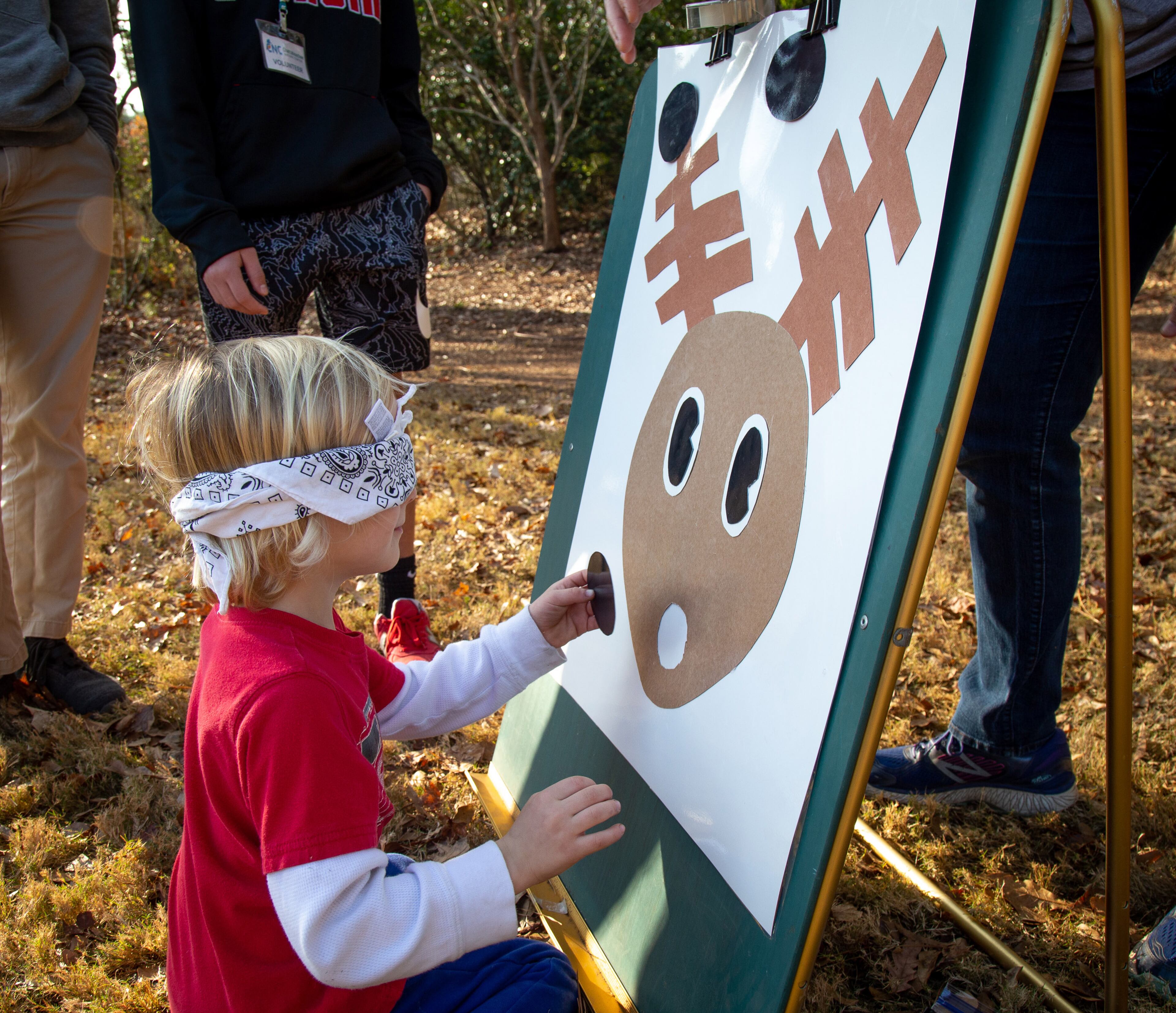 Sean Perry tries to pin the nose on the reindeer during the Enchanted Woodland Wonders family fun day at the Chattahoochee Nature Center Sunday, 15 2019. STEVE SCHAEFER / SPECIAL TO THE AJC