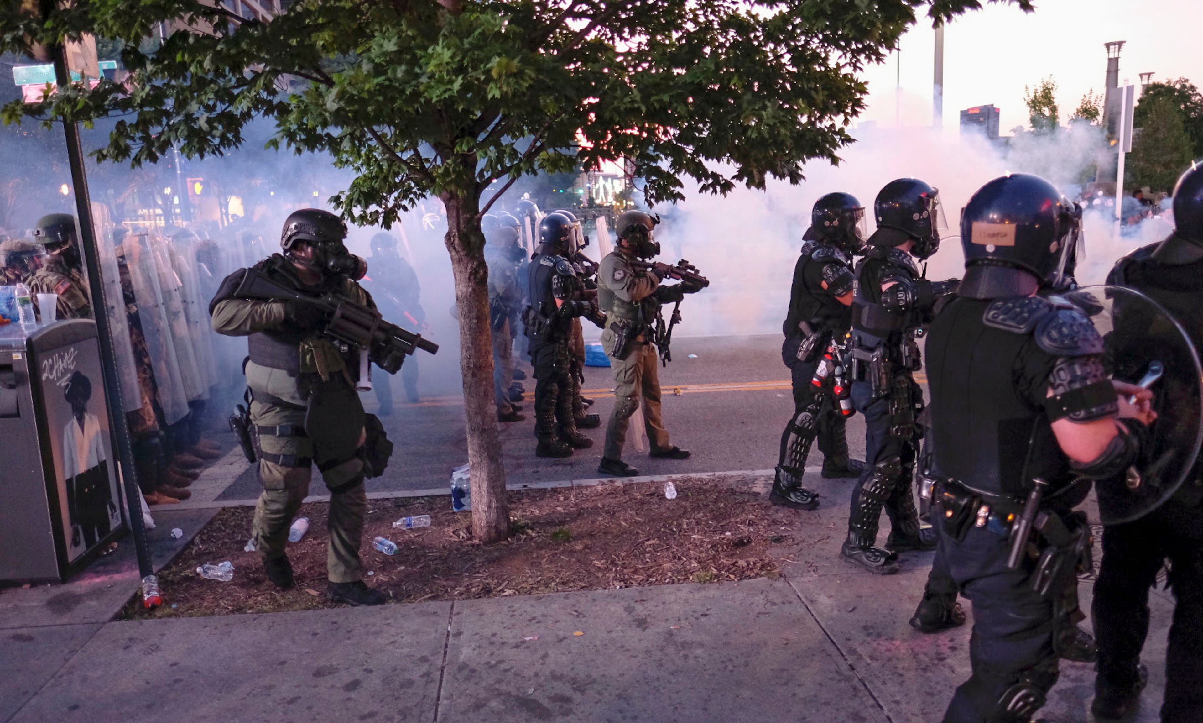 June 2, 2020 - Atlanta - Protestors dodge tear gas and police after the 9pm curfew in downtown Atlanta as protests continued for a fourth day. Protests over the death of George Floyd in Minneapolis police custody continued around the United States, as his case renewed anger about others involving African Americans, police and race relations. Ben Gray for the Atlanta Journal Constitution