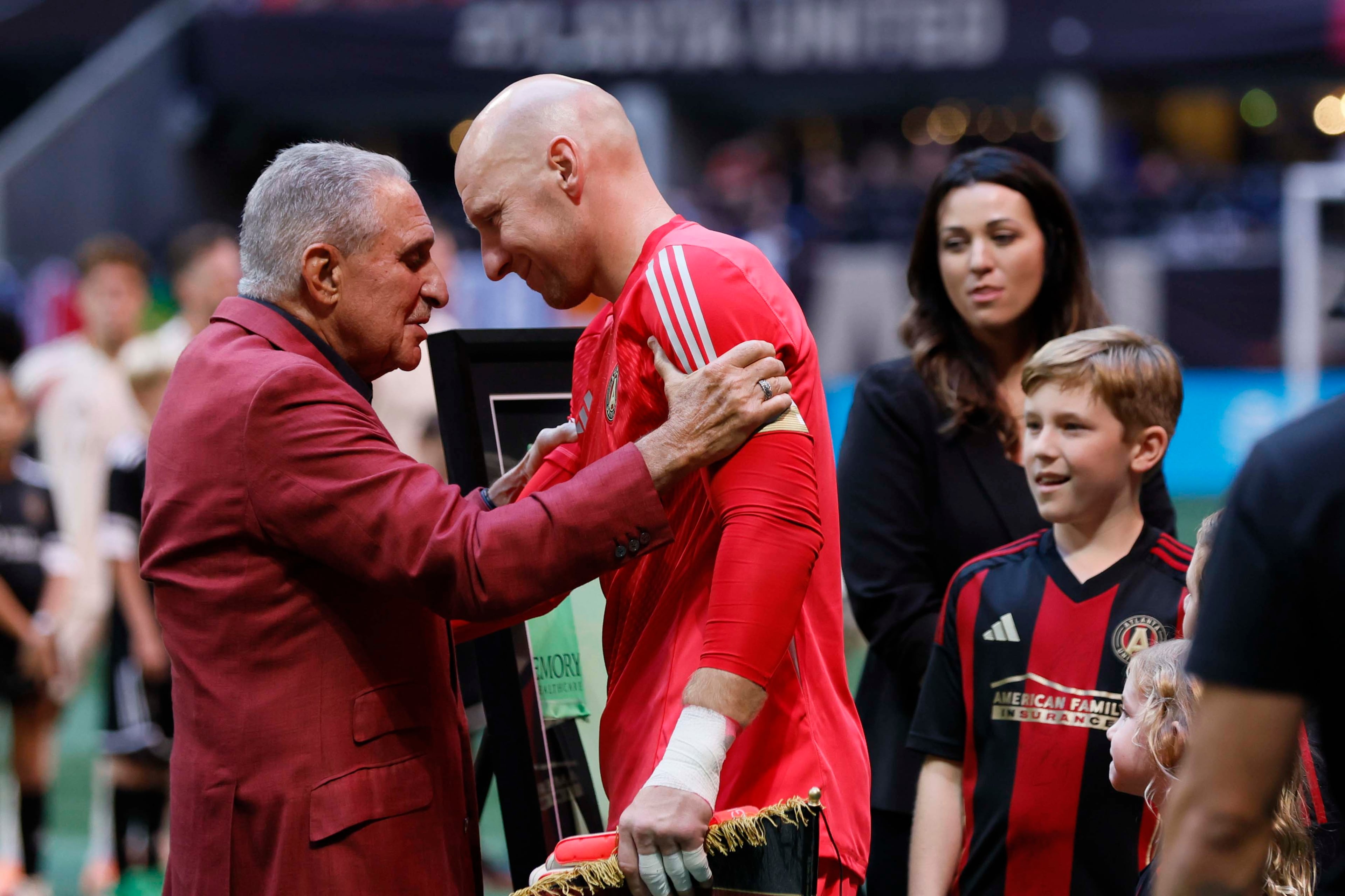 Atlanta United owner Arthur Blank (left) embraces goalkeeper Brad Guzan as Guzan prepares to play his last game Saturday, Oct. 18, 2025, at Mercedes-Benz Stadium in Atlanta. (Miguel Martinez/AJC)