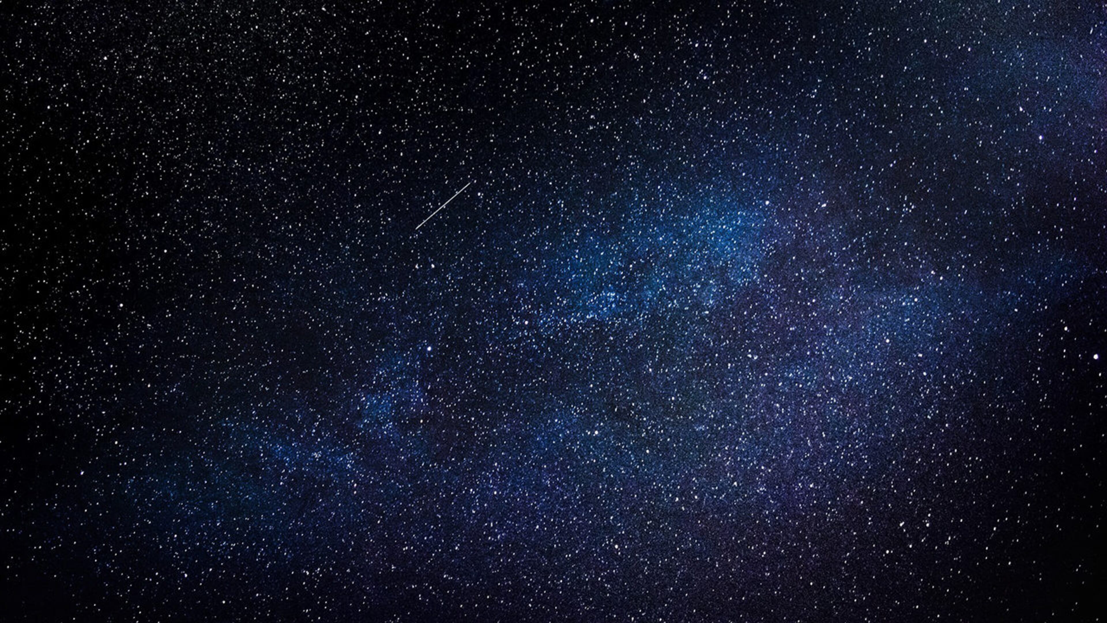 Stock photo of a meteor in the night sky.