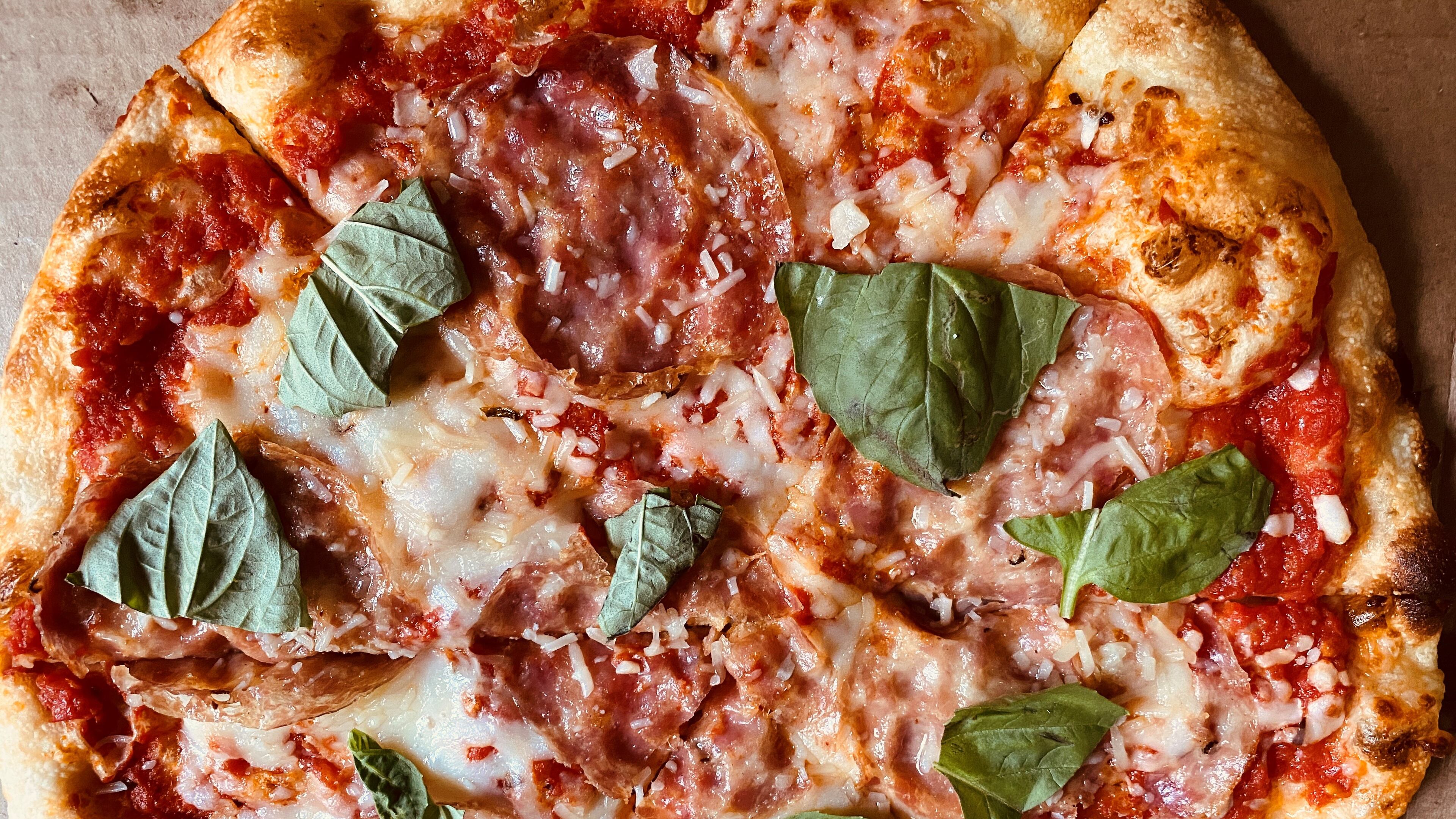 The 1836 pizza from Bold Monk Brewing Co. features soppressata, tomato, mozzarella and torn basil. Bob Townsend for The Atlanta Journal-Constitution