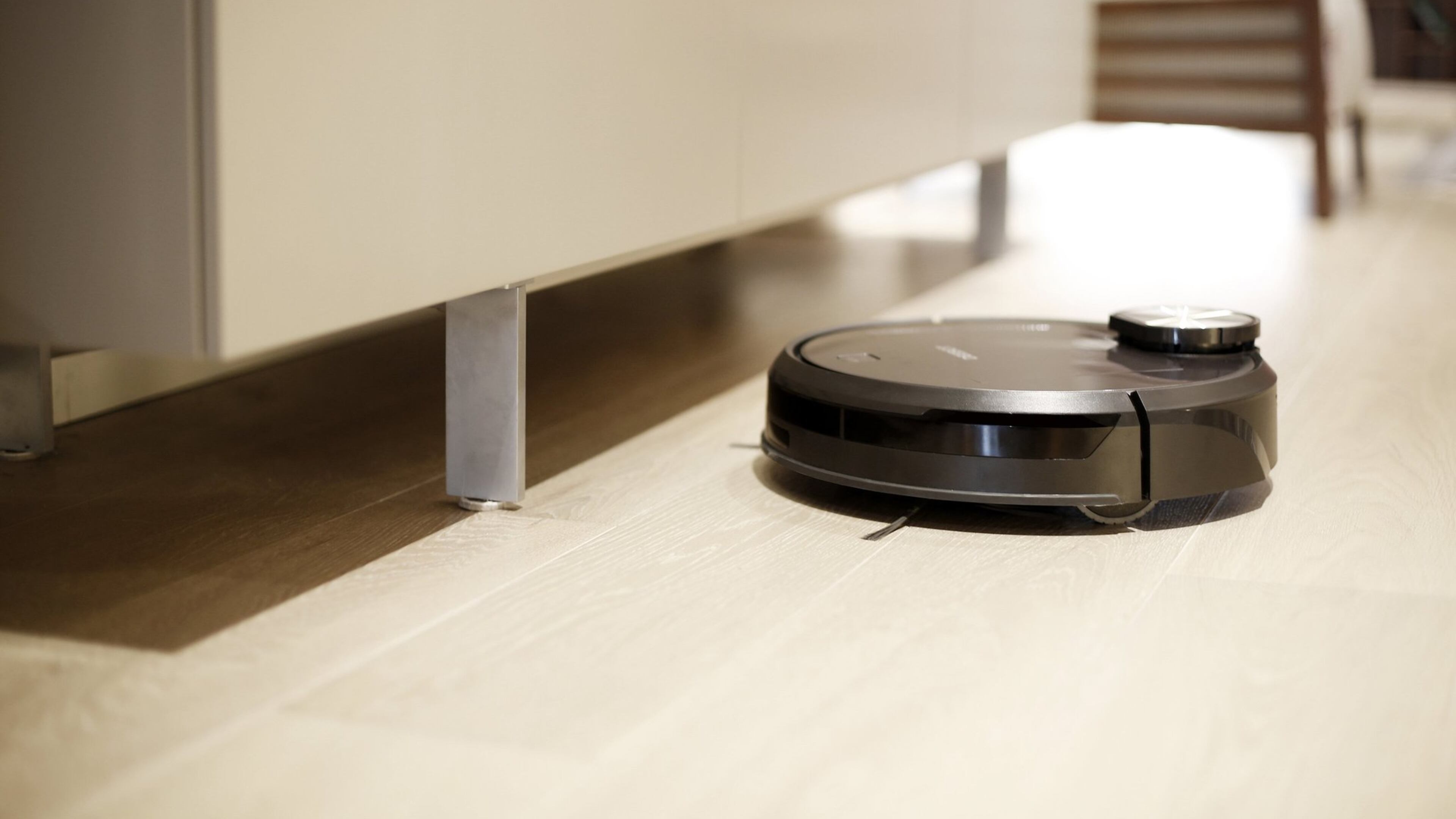 The Deebot (13.9-by-13.9-by-4 inches, 10.6 pounds) has left and right handed rotor brushes to help get most everything in its way. (www.ecovacs.com)