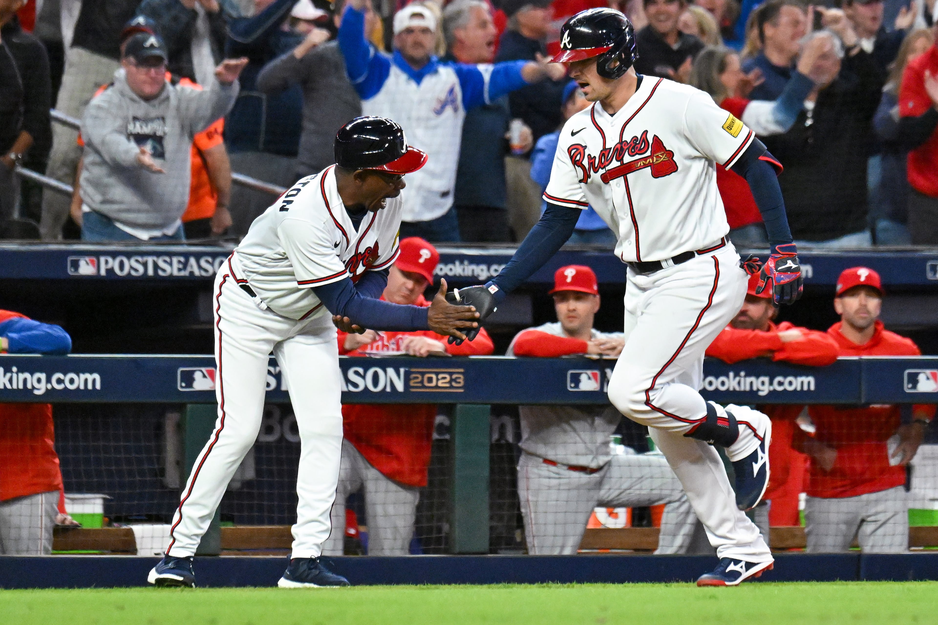 Atlanta Braves’ Austin Riley (27) celebrates a two-run home run against the Philadelphia Phillies during the eighth inning of NLDS Game 2 in Atlanta on Monday, Oct. 9, 2023. (Hyosub Shin / Hyosub.Shin@ajc.com)