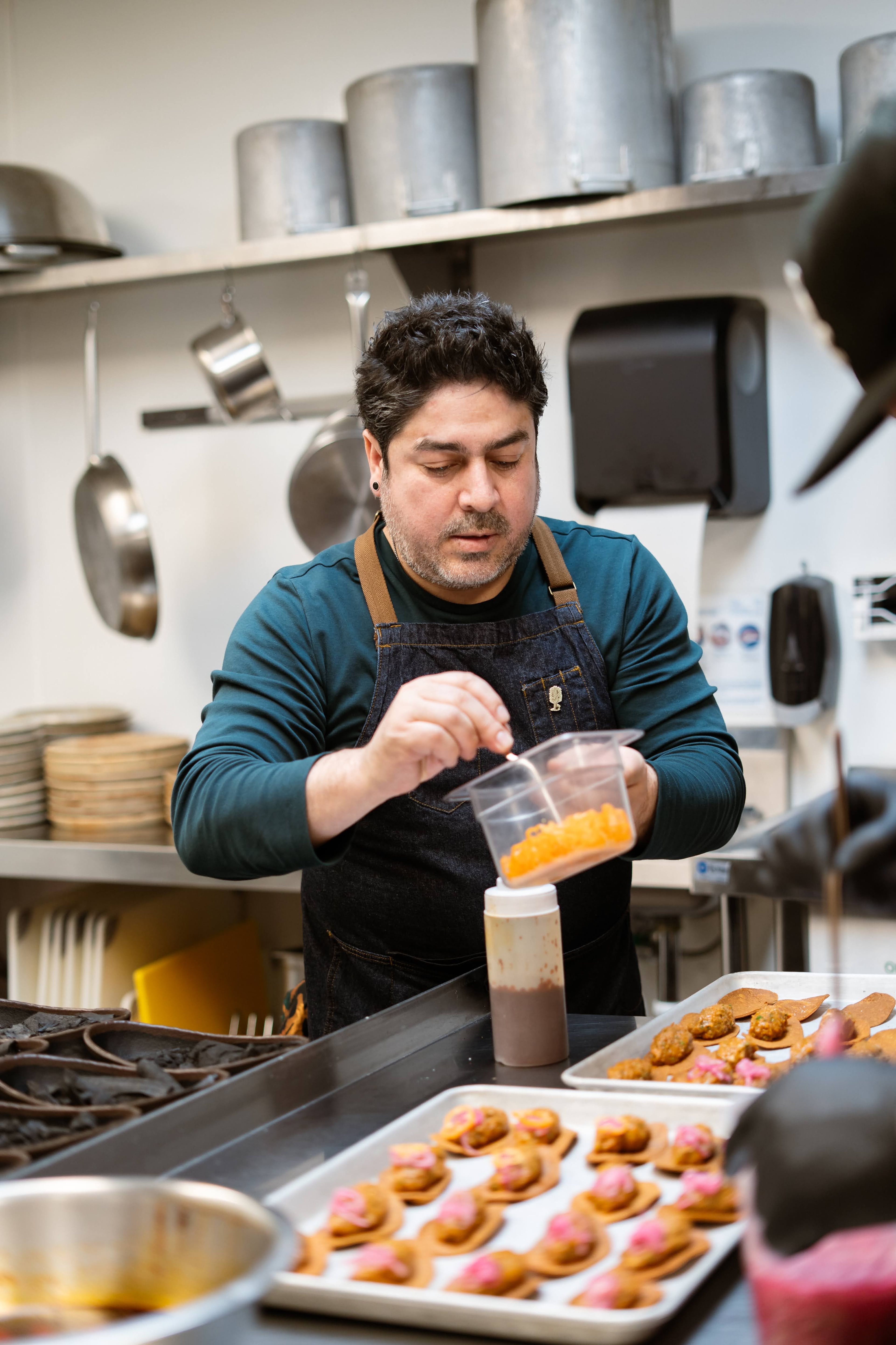 Chef Octavio Aguirre at work in the Patria Mezcaleria kitchen. (Courtesy of Patria Mezcaleria)