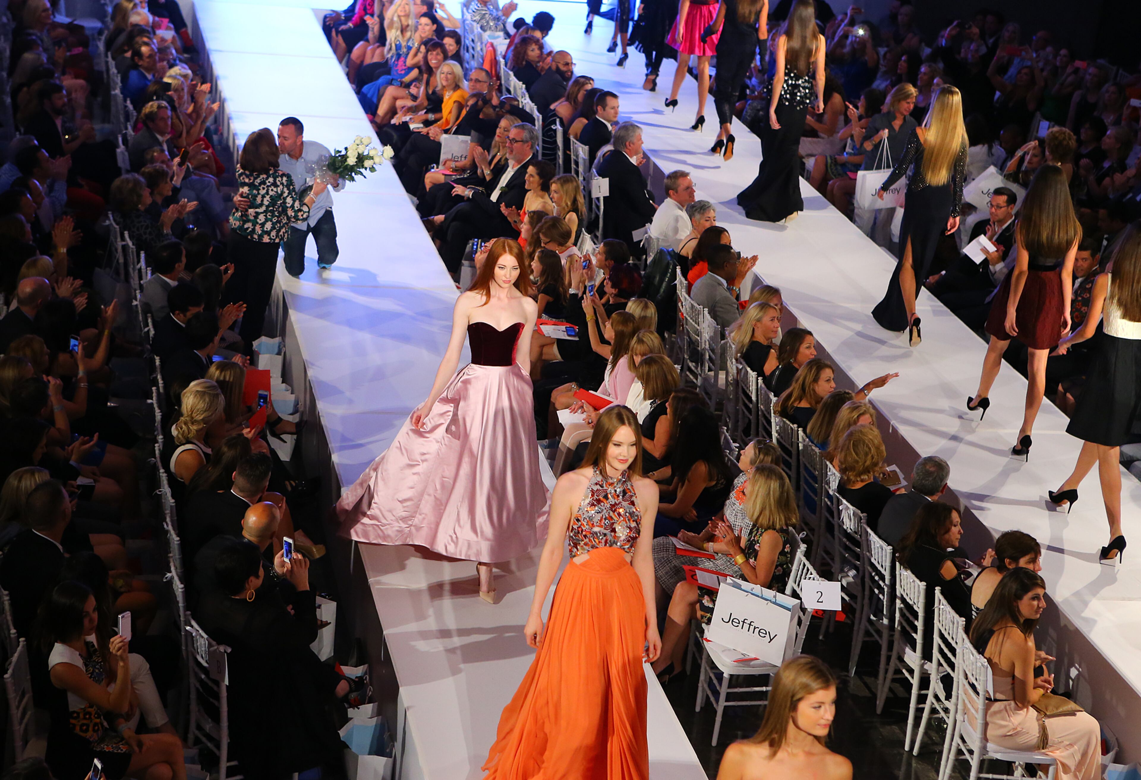 Jeffrey Kolinsky gets flowers and a kiss from audience members at the conclusion of the Jeffrey Cares Fashion Show Monday, Aug. 25, 2014, in Atlanta. The show raises awareness and funds for its beneficiaries the Susan G. Komen for the Cure Greater Atlanta Affiliate and the Atlanta AIDS Fund. CURTIS COMPTON / CCOMPTON@AJC.COM