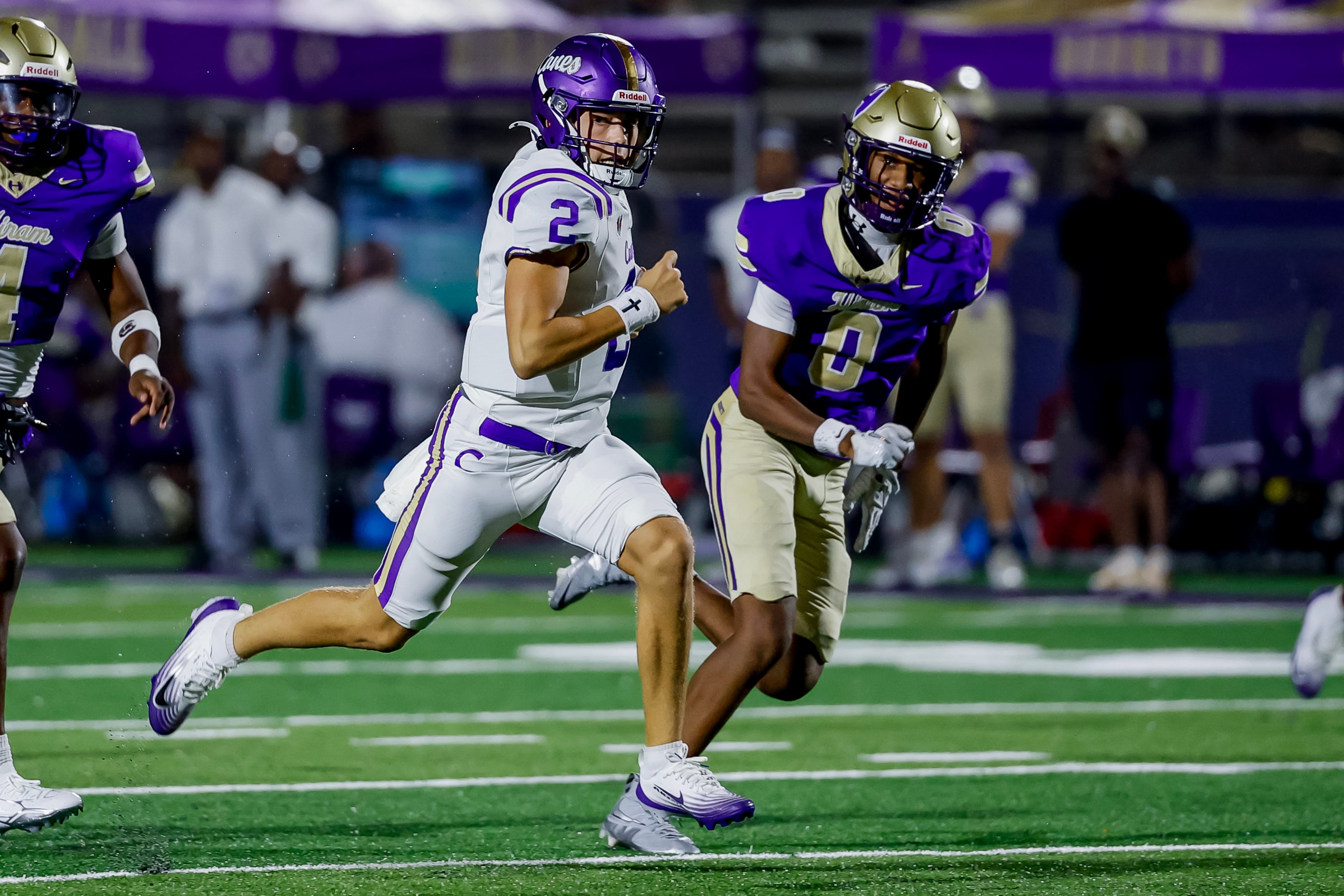 Cartersville quarterback Brody Jones (left) runs against Hiram free safety Kendall Robinson on Friday, Aug. 21, 2026, in Hiram. (Erik S. Lesser for the AJC)