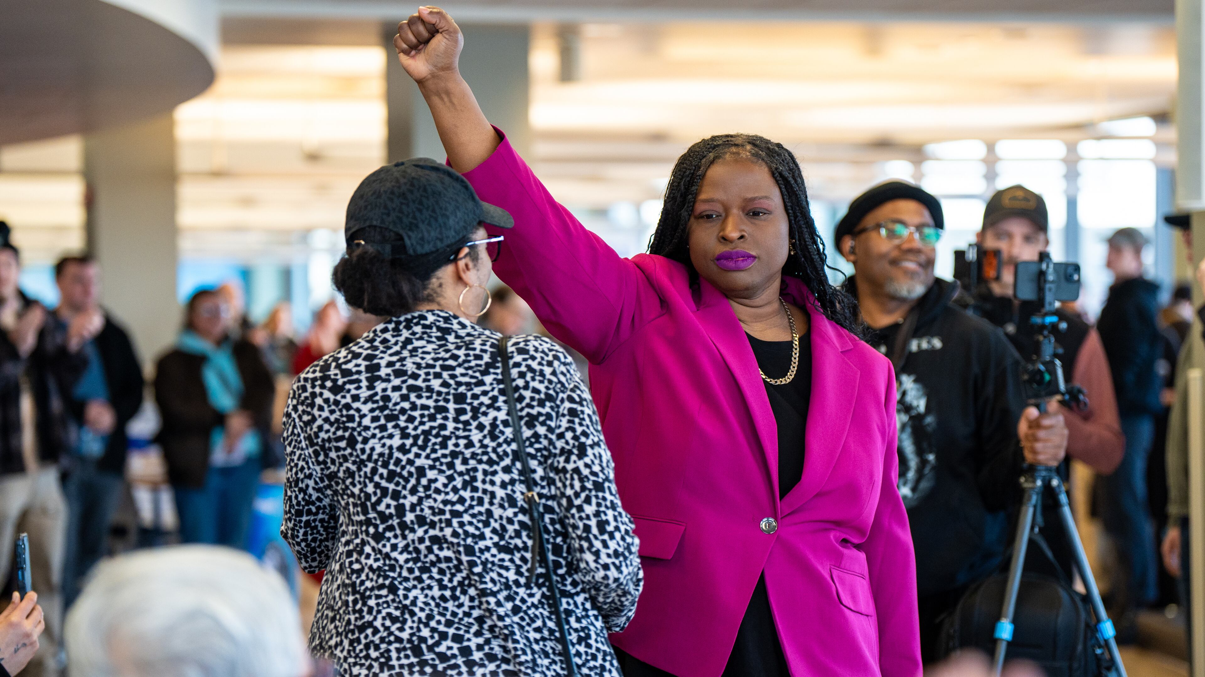 FILE - Nekima Levy Armstrong holds up her fist after speaking at an anti-ICE rally for Martin Luther King Jr., Monday, Jan. 19, 2026, in St. Paul, Minn. (AP Photo/Angelina Katsanis, File)