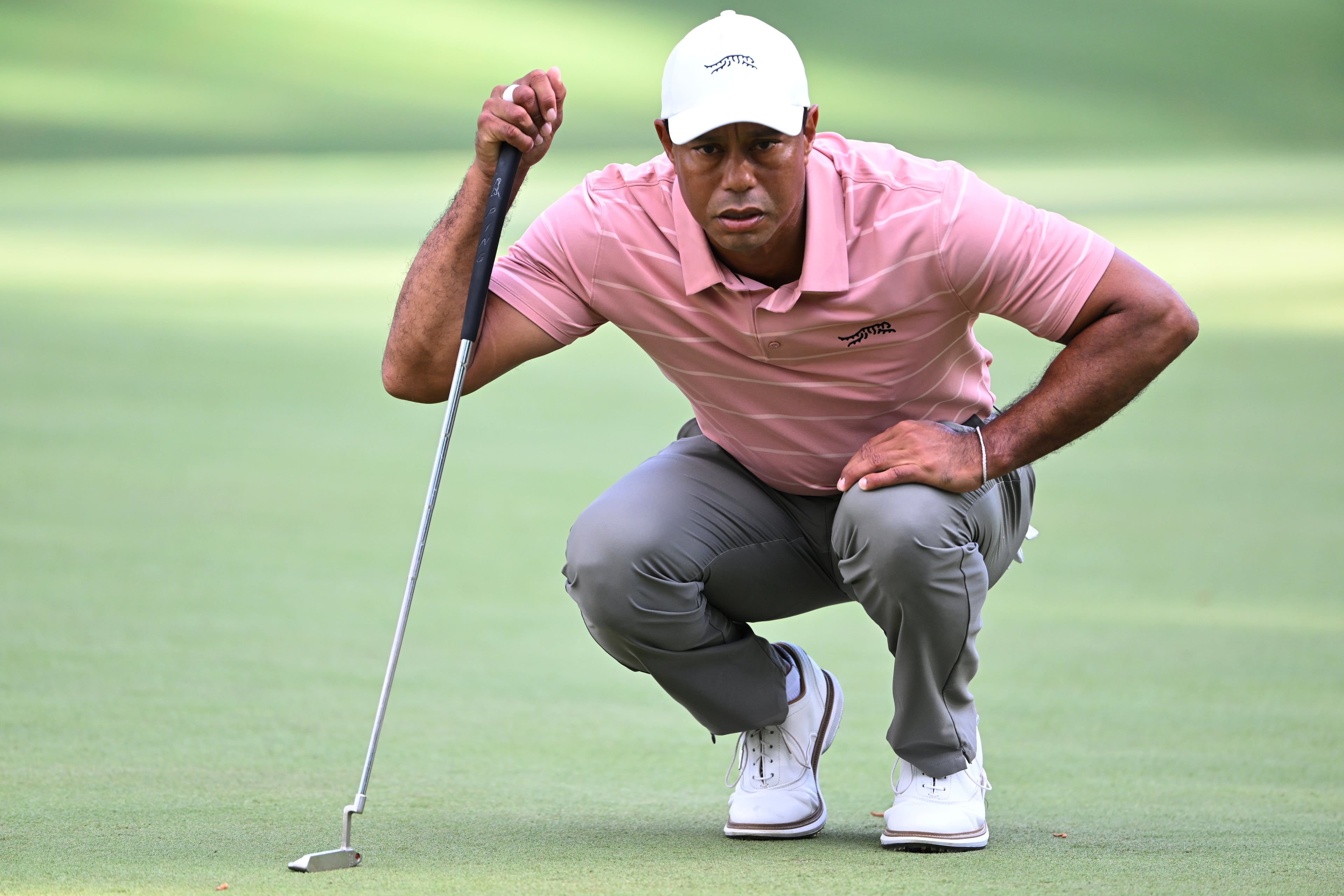 Tiger Woods lines up a putt on sixth green at the 2024 Masters Tournament at Augusta National Golf Club, Thursday, April 11, 2024, in Augusta, Ga. (Hyosub Shin / Hyosub.Shin@ajc.com)