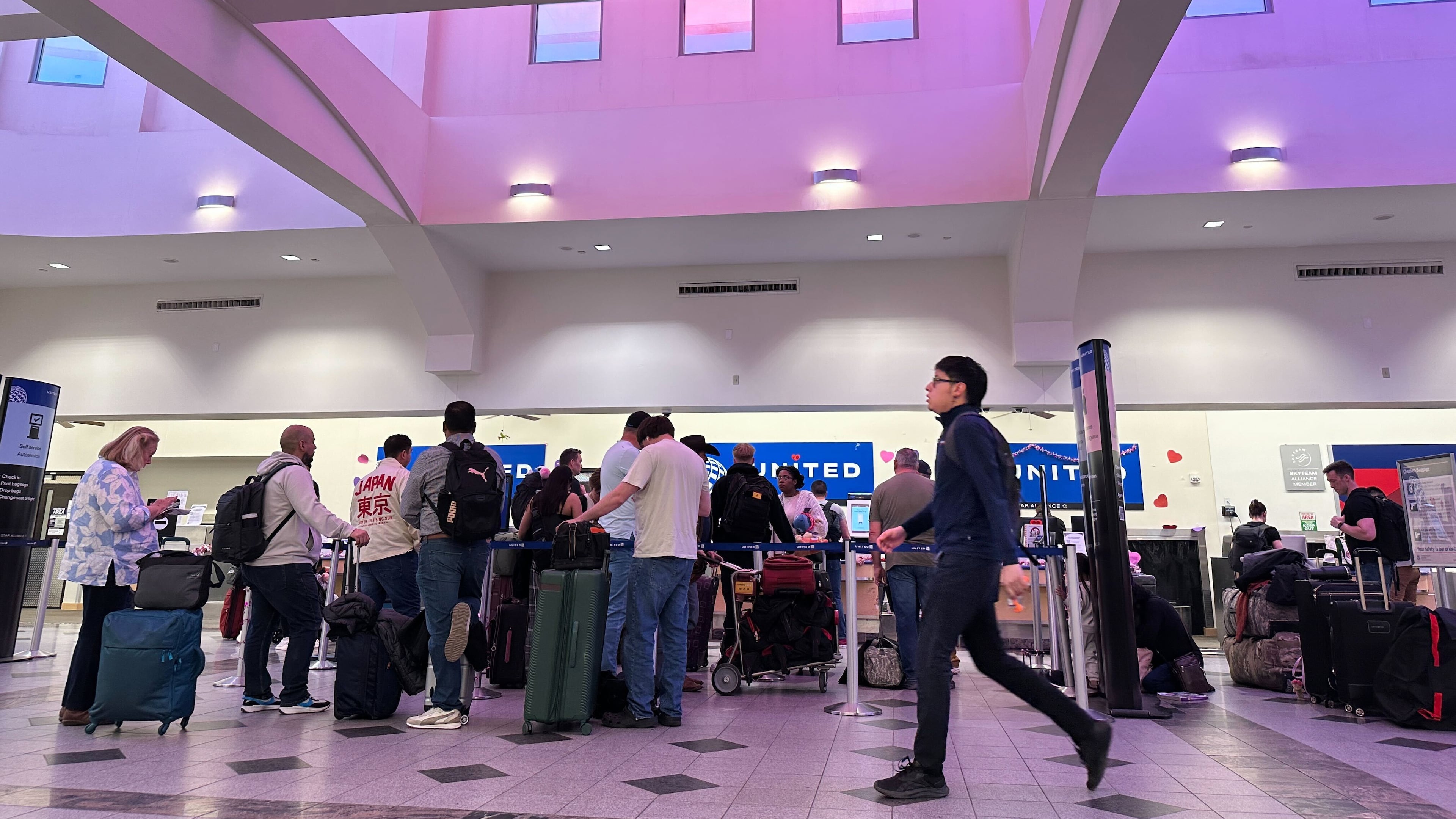 FILE - People stand in line at check-in counters at El Paso International Airport, Wednesday, Feb. 11, 2026, in El Paso, Texas. (AP Photo/Morgan Lee,File)