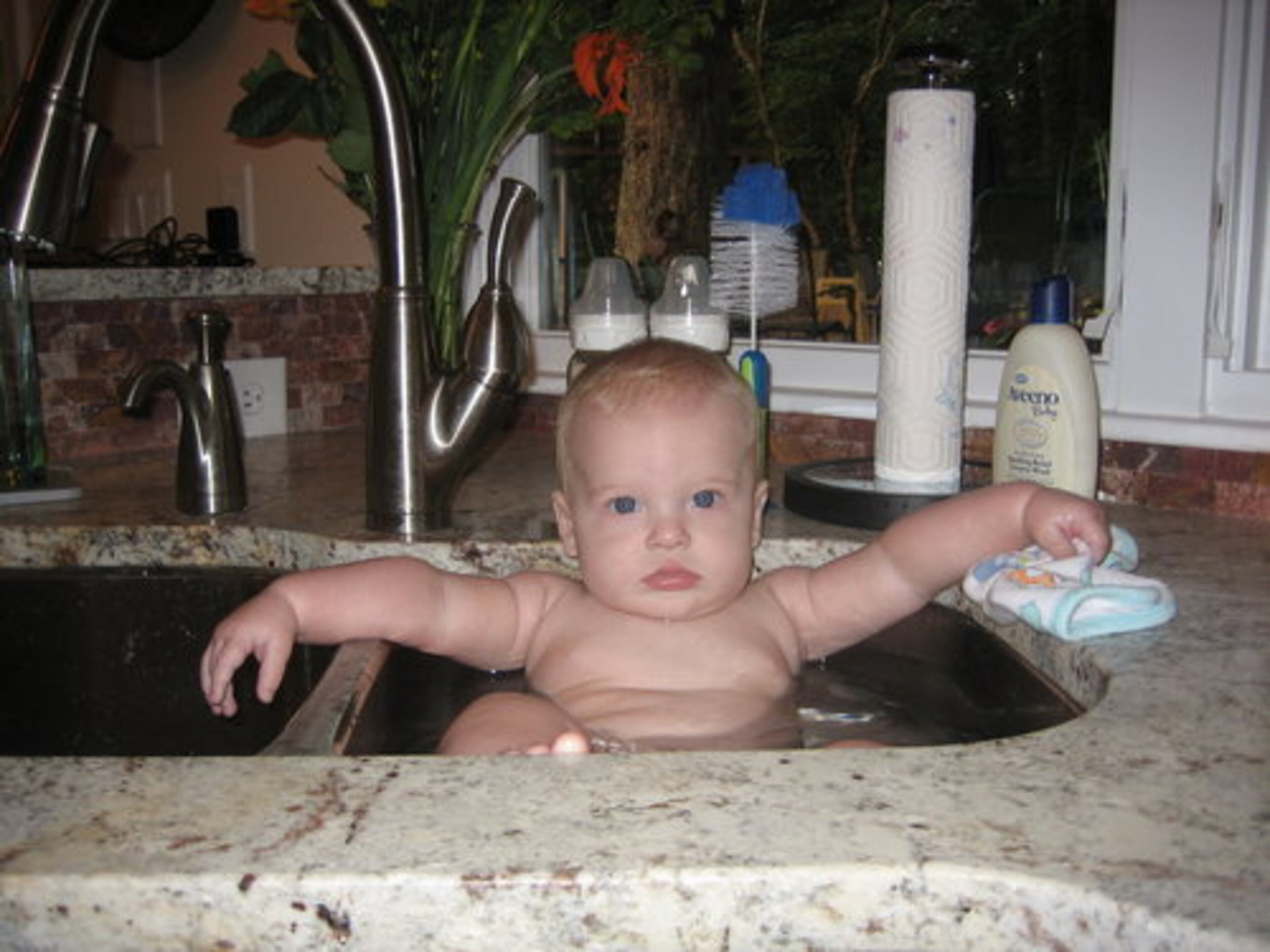 Grant in granite, "I just love my new hot tub!"