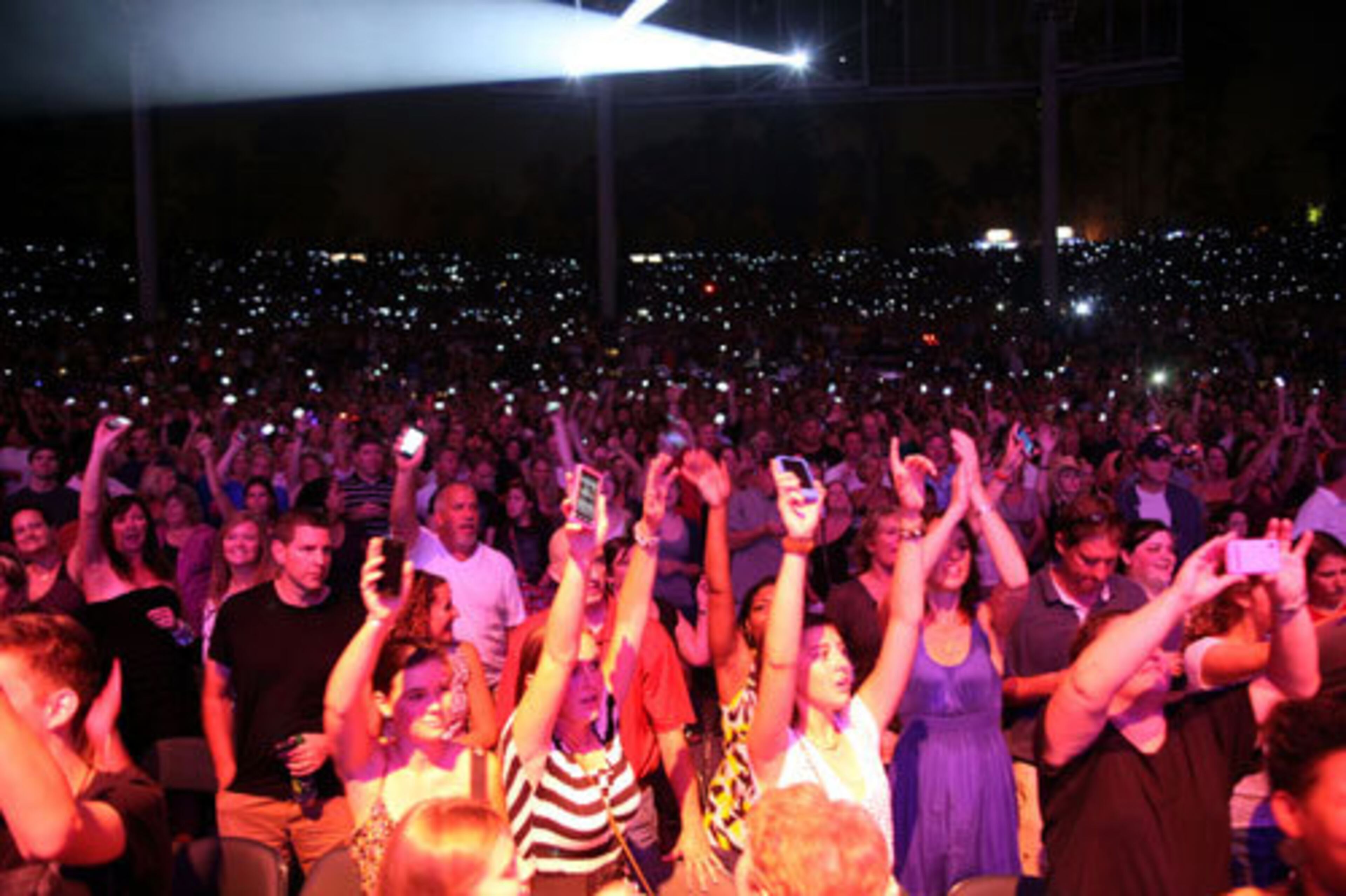 Fans hold up their phones in a quieter moment during Train's set.