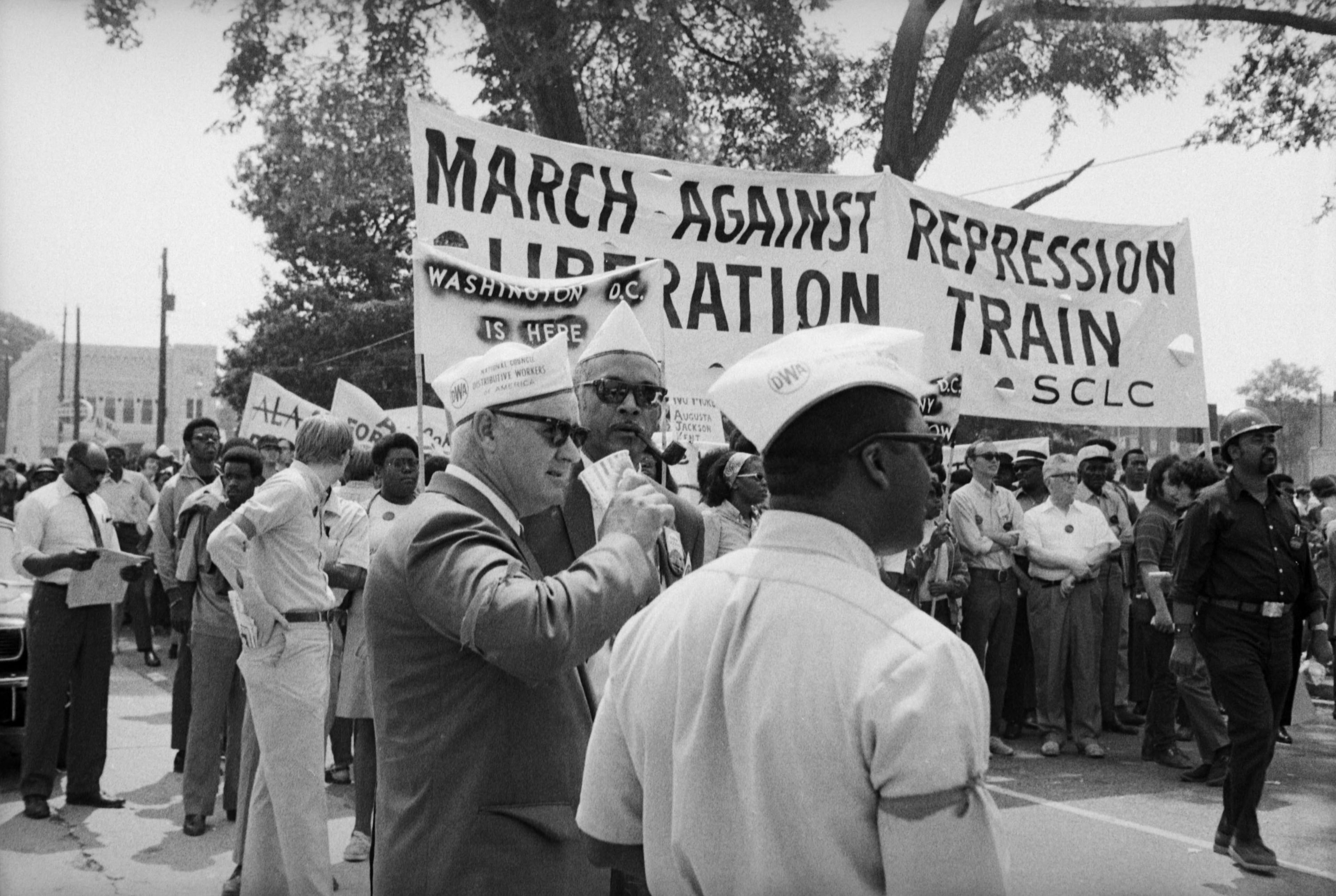 In May 1970, Reverend Ralph David Abernathy helped lead the “March Against Oppression” to protest the shooting deaths by police of black demonstrators and students in Augusta, Georgia, and Jackson Mississippi, and four white students at Kent State University by the National Guard.The march, which began in Perry, Georgia, culminated in Atlanta as Abernathy was joined by United Auto Worker’s President Leonard Woodcock and other prominent national figures. Read more about the work of Boyd Lewis and the new exhibition of his work here.